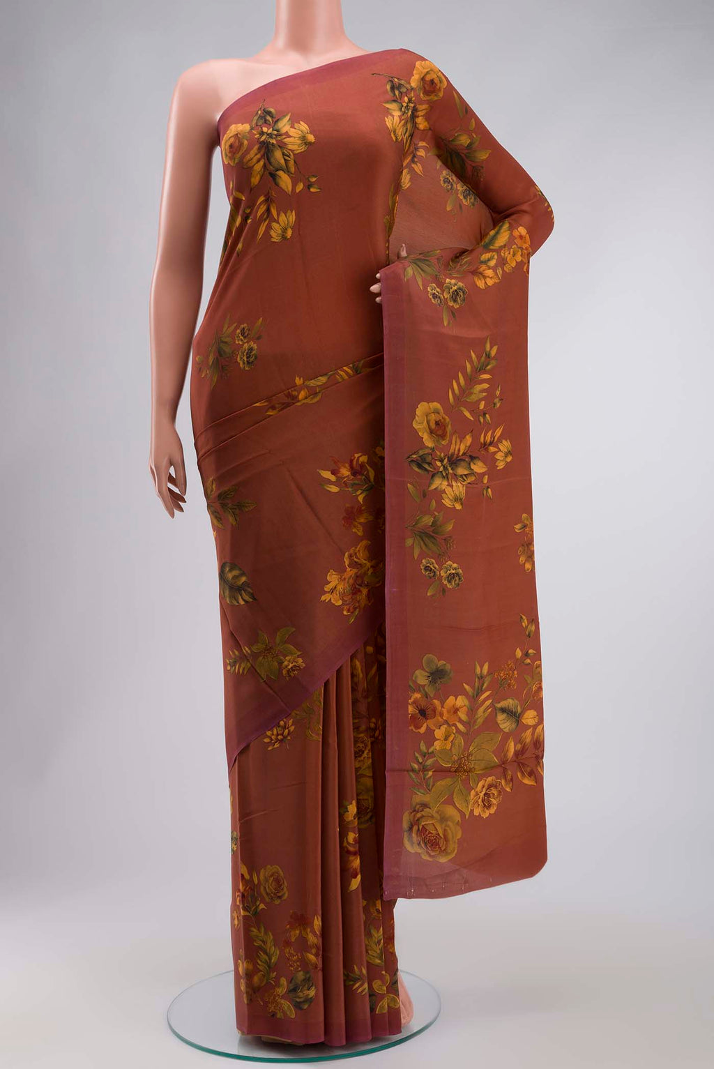 Brown Mysore Crepe Saree with Printed design on the body and Plain Border displayed on a mannequin