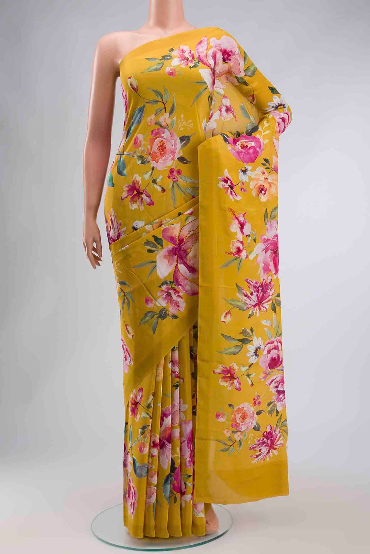 Yellow Mysore Crepe Saree with Printed design on the body and Plain Border displayed on a mannequin
