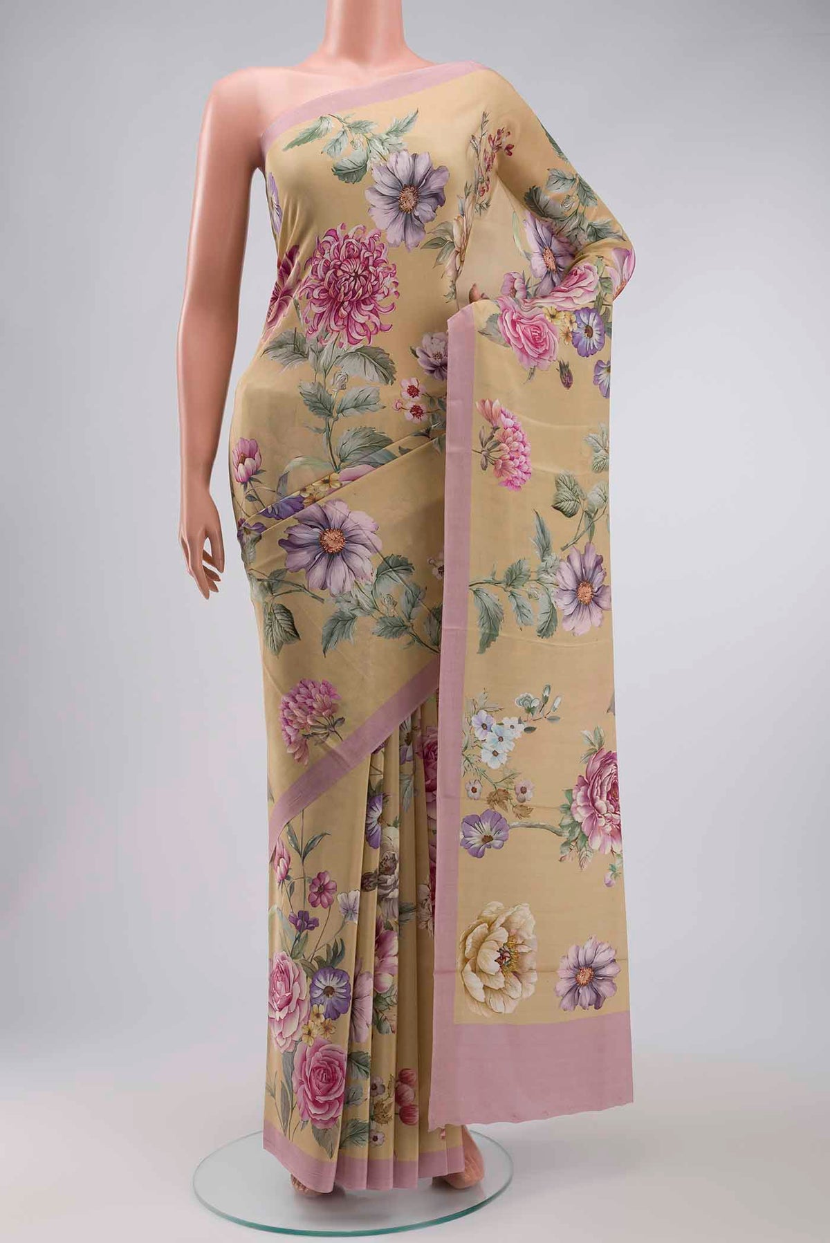 Beige Mysore Crepe Saree with Printed design on the body and Plain Border displayed on a mannequin