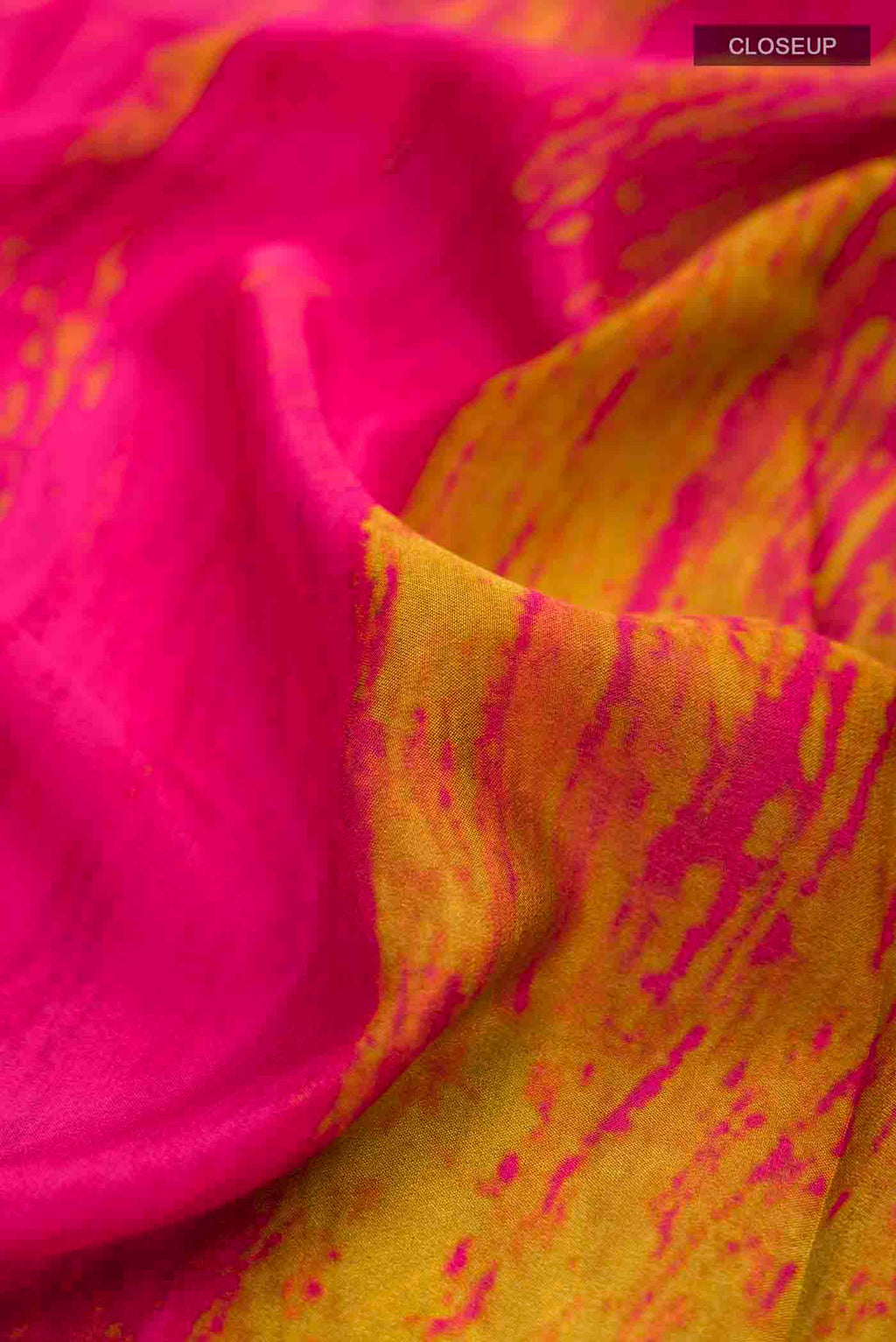 Close up of Red Mysore Crepe Saree with Printed design on the body and Printed Border displaying folds
