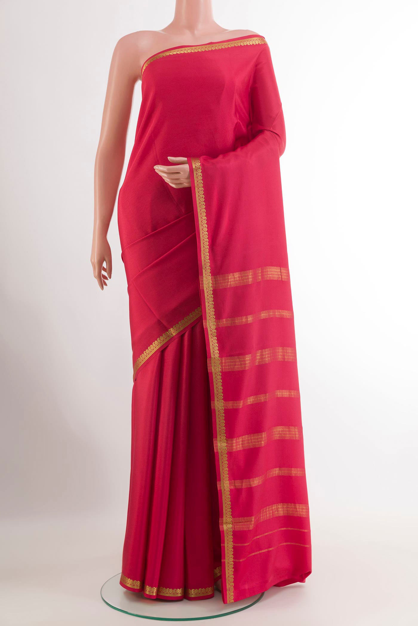 Pink Mysore Crepe Saree with Plain Body and Zari Border.  displayed on a mannequin