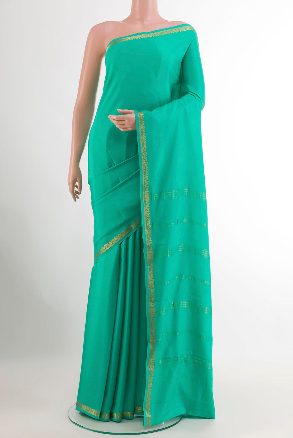 Sea Green Mysore Crepe Saree with Plain Body and Zari Border.  displayed on a mannequin
