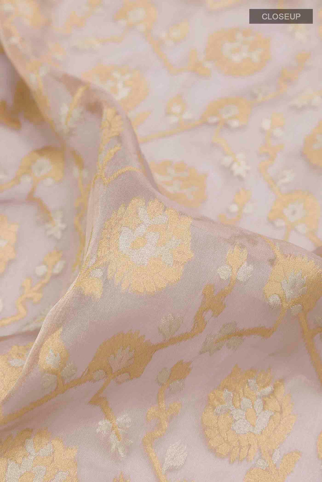 Close up of Lavender Banarasi Kora Silk Saree with Zari Brocade on the body and Zari Border displaying folds