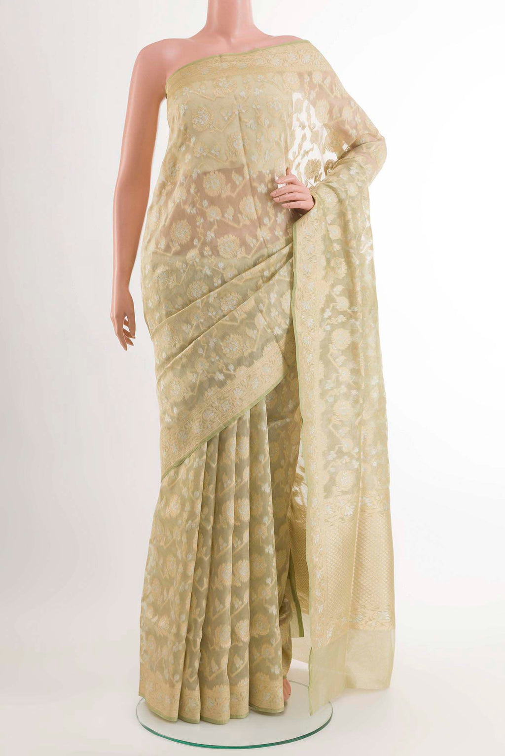 Green Banarasi Kora Silk Saree with Zari Brocade on the body and Zari Border displayed on a mannequin