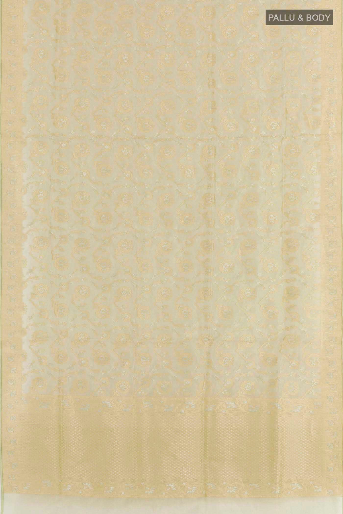 Flat view of Green Banarasi Kora Silk Saree with Zari Brocade on the body and Zari Border