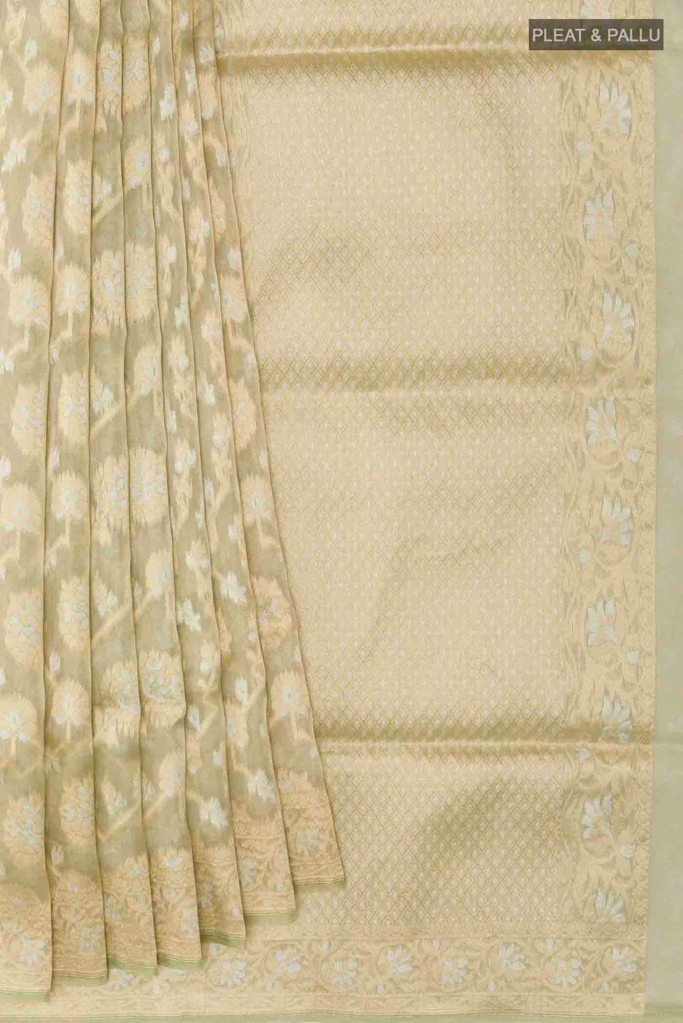 Pleats and pallu of Green Banarasi Kora Silk Saree with Zari Brocade on the body and Zari Border