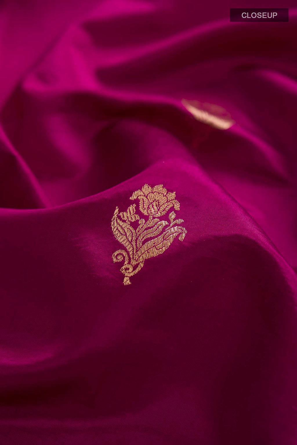 Close up of Purple Banarasi Katan Silk Saree with Zari Butta on the body and Zari Border displaying folds