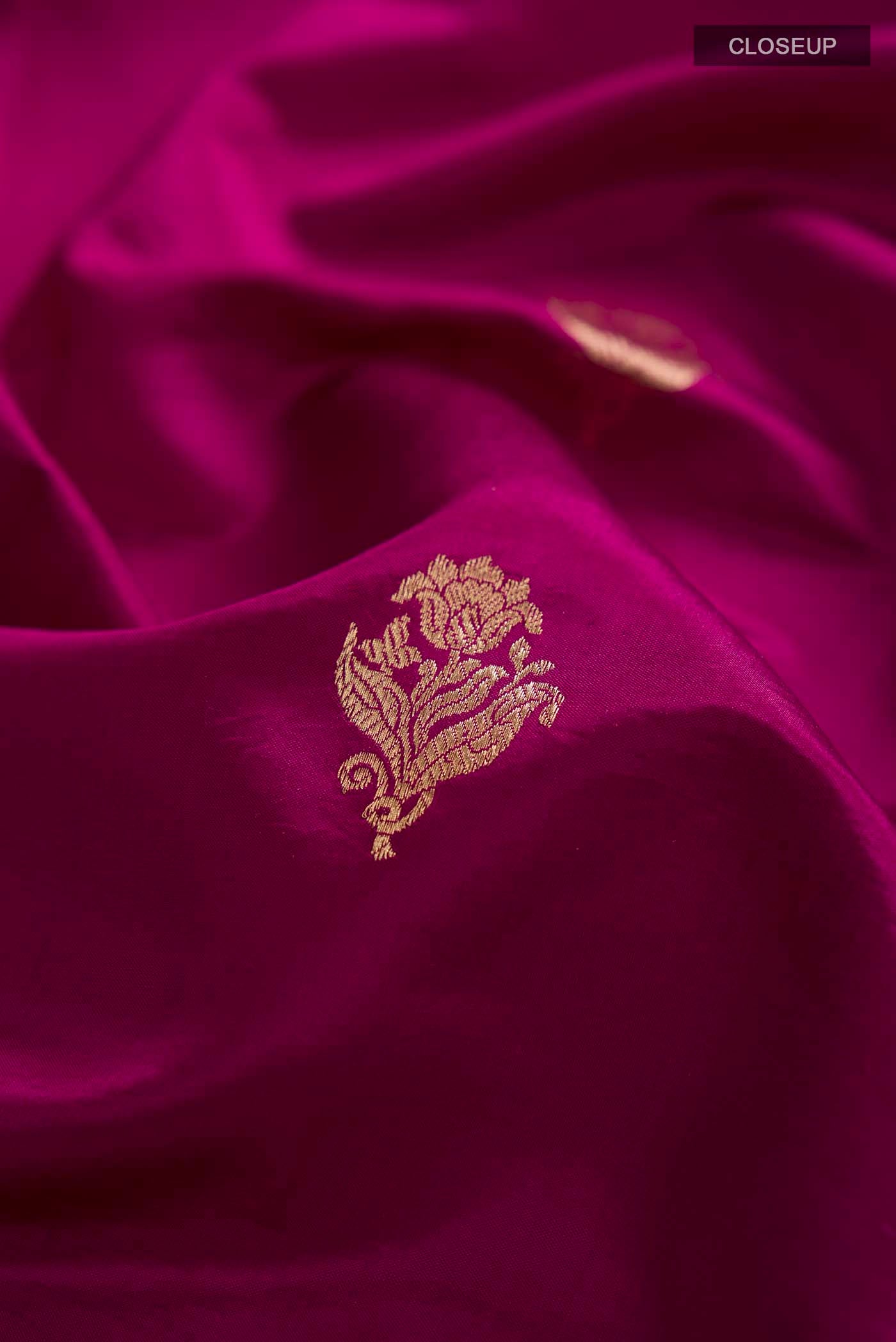 Close up of Purple Banarasi Katan Silk Saree with Zari Butta on the body and Zari Border displaying folds