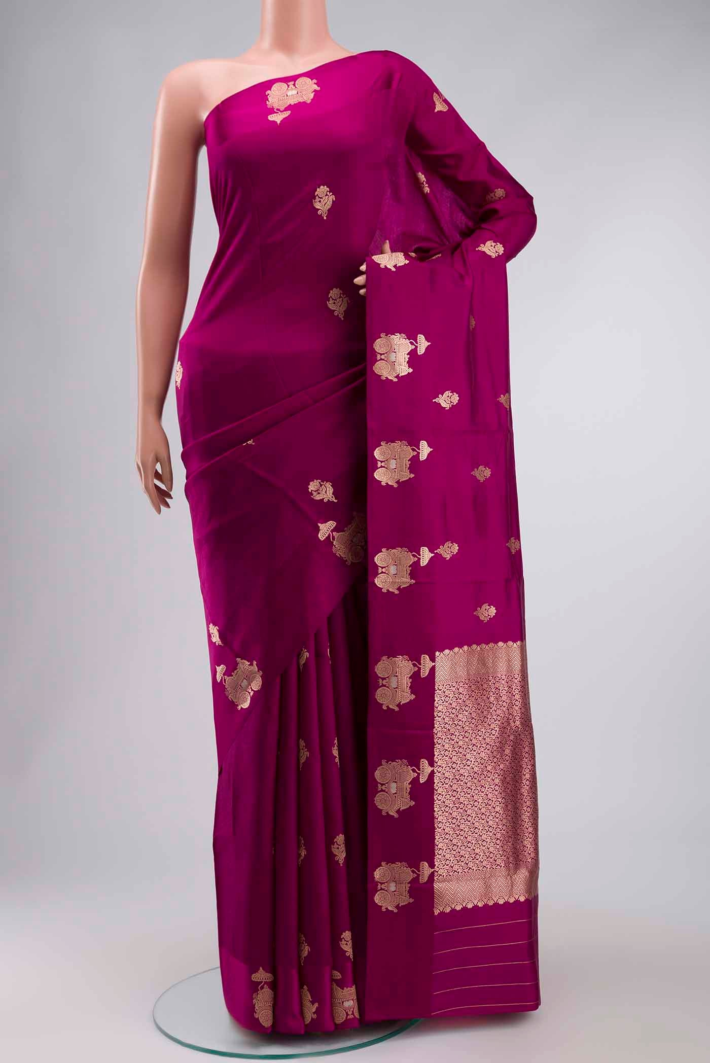 Purple Banarasi Katan Silk Saree with Zari Butta on the body and Zari Border displayed on a mannequin