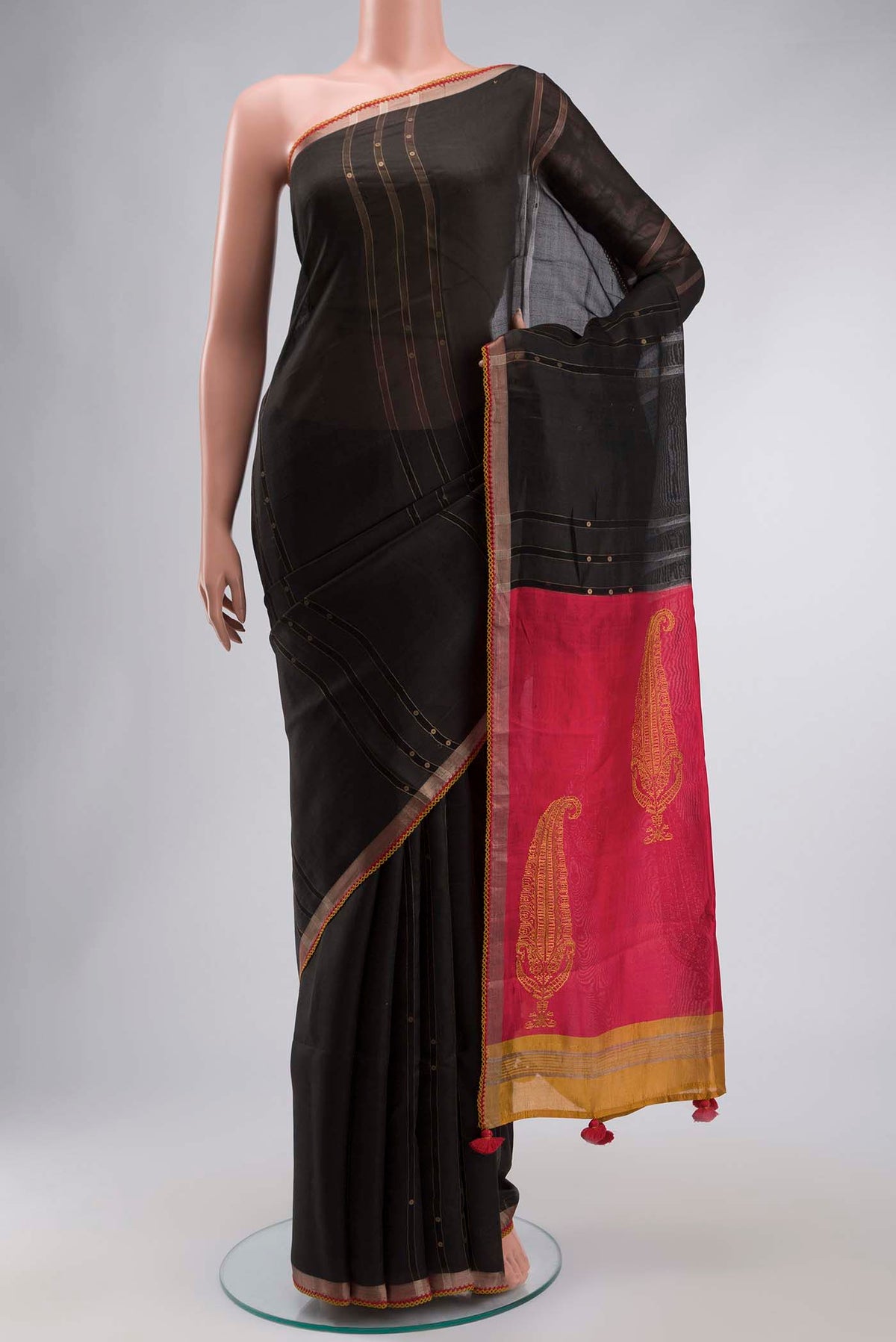 Black Tussar Silk Saree with Stripes on the body and Embroidery Border displayed on a mannequin