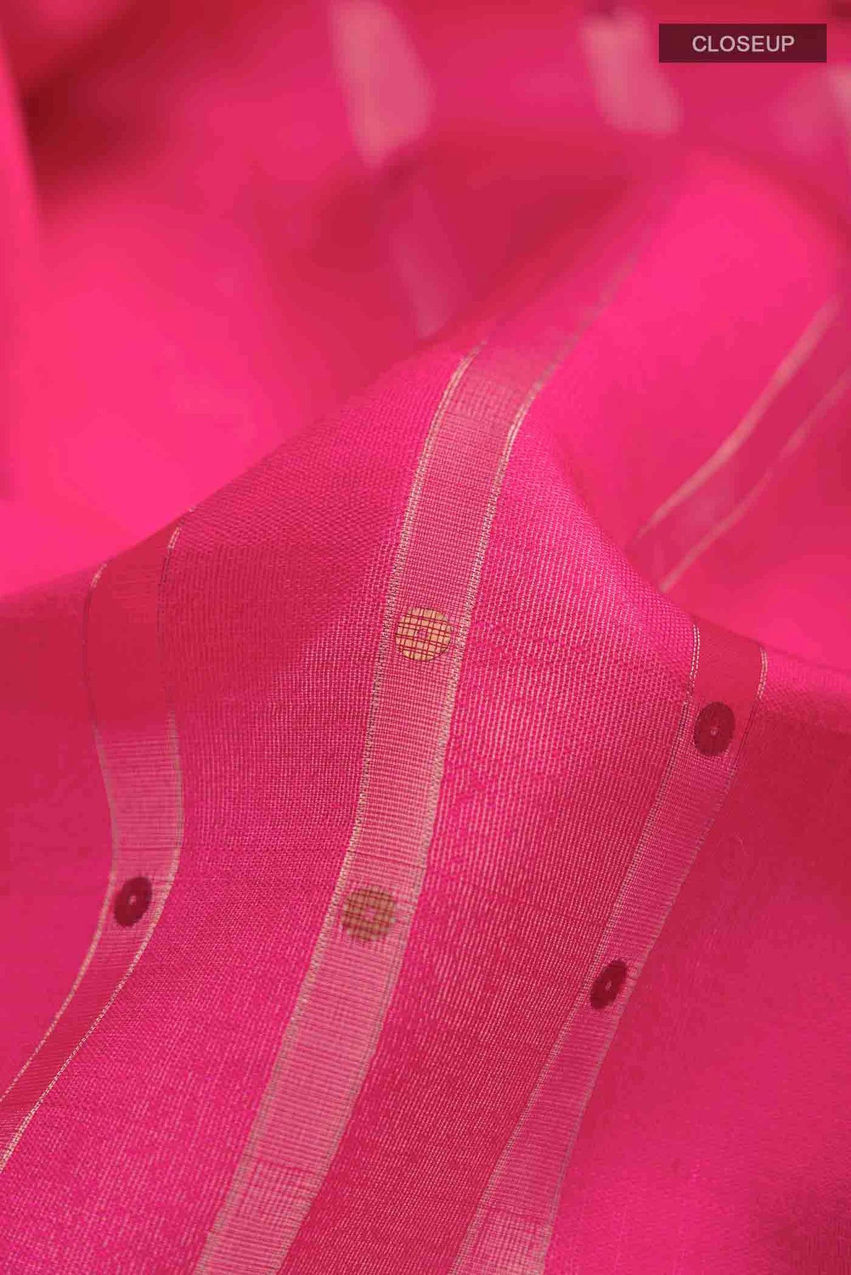 Close up of Pink Tussar Silk Saree with Stripes on the body and Embroidery Border displaying folds