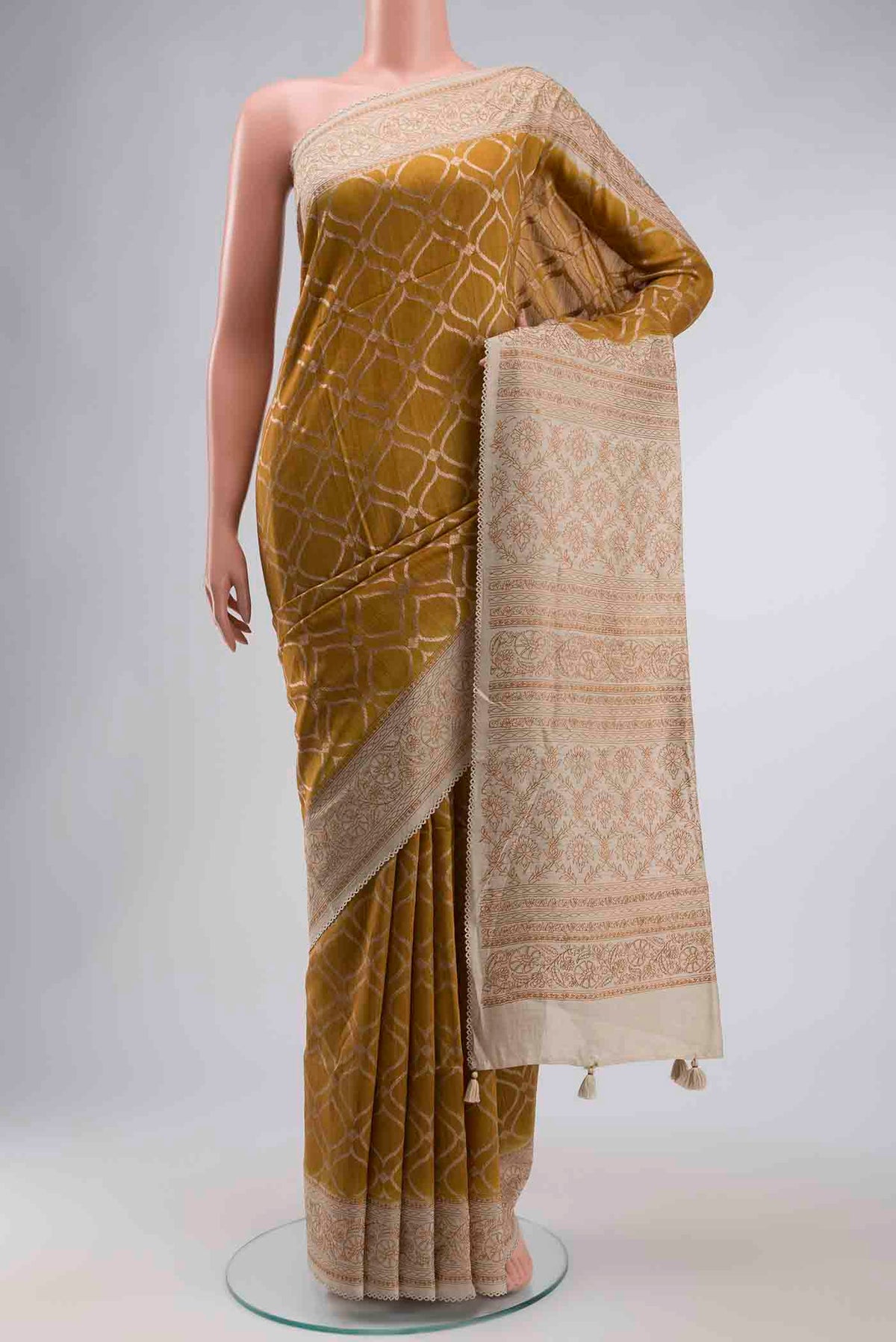 Mustard Tussar Silk Saree with Zari Butta on the body and Embroidery Border displayed on a mannequin