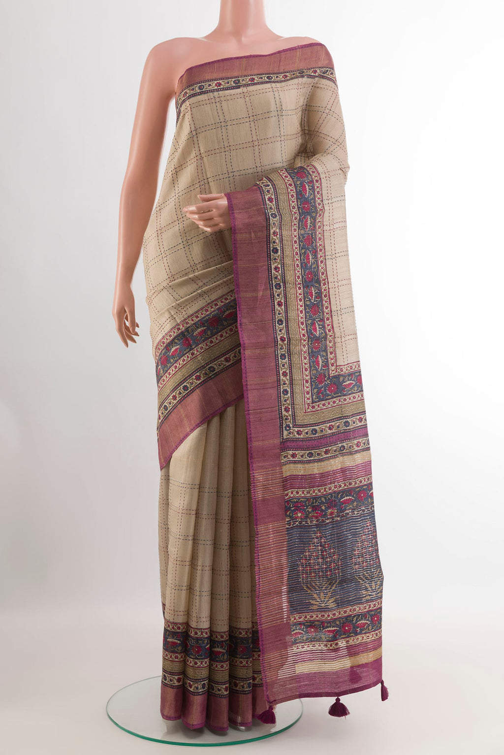 Beige Tussar Saree with Checked design on the body and Zari Border.  displayed on a mannequin