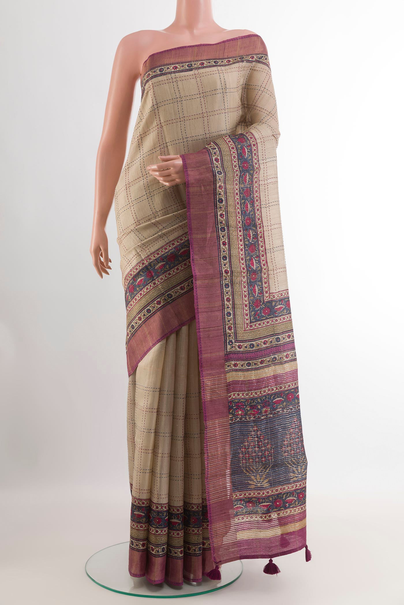 Beige Tussar Saree with Checked design on the body and Zari Border.  displayed on a mannequin