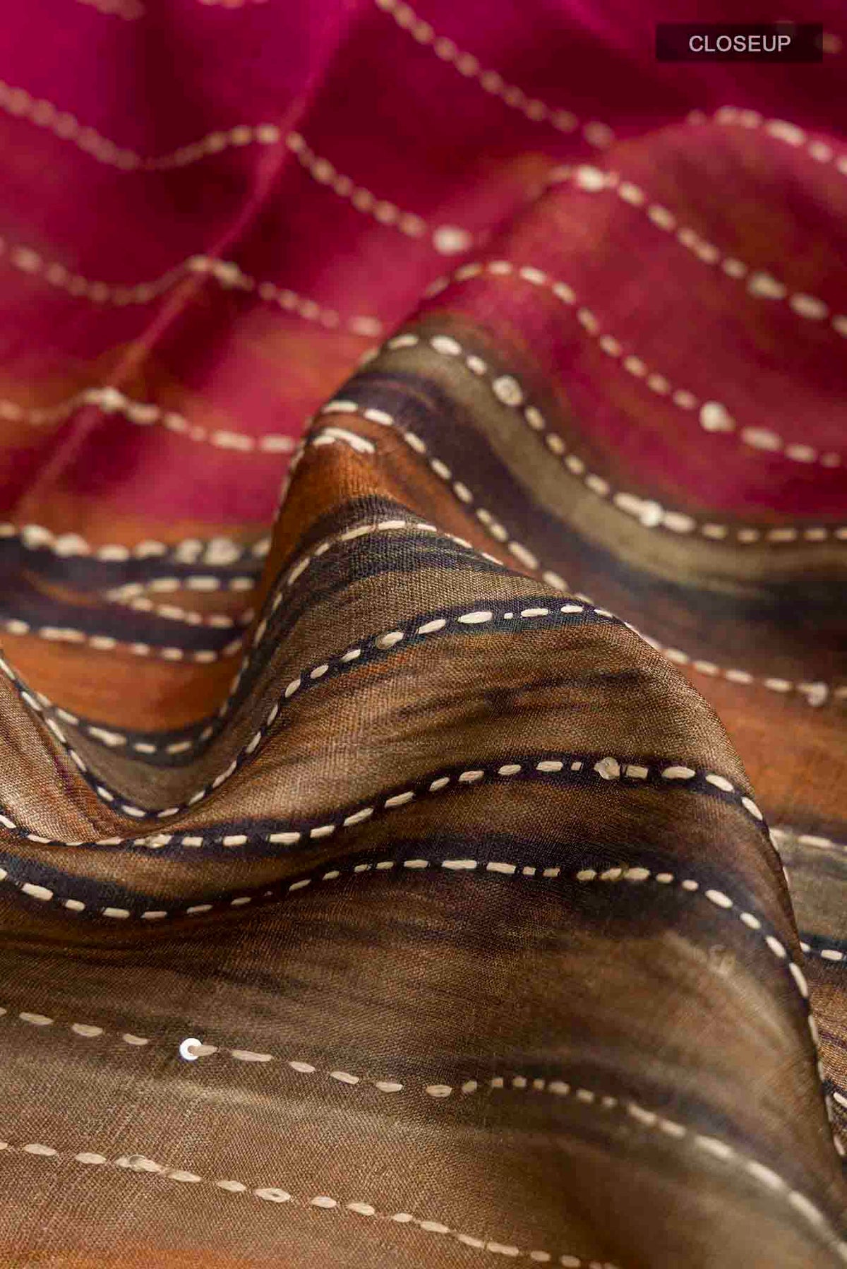 Close up of Multi Color Tussar Silk Saree with Embroidery on the body and Embroidery Border displaying folds