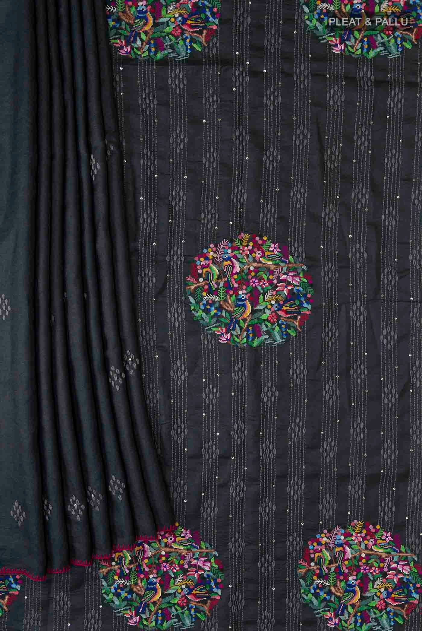 Pleats and pallu of Black Tussar Silk Saree with Plain Body and Embroidery Border