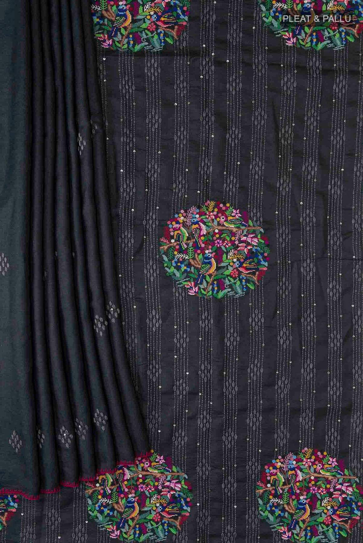 Pleats and pallu of Black Tussar Silk Saree with Plain Body and Embroidery Border