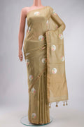Beige Tussar Silk Saree with Embroidery on the body and Zari Border displayed on a mannequin
