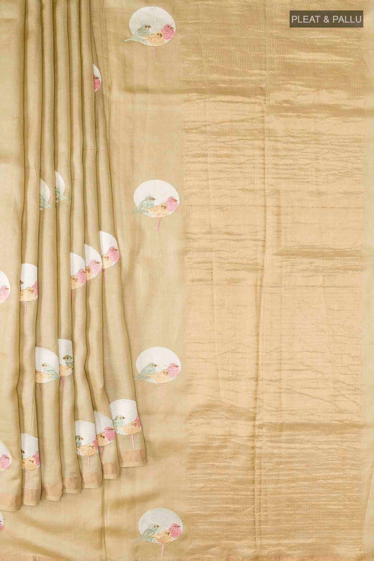 Pleats and pallu of Beige Tussar Silk Saree with Embroidery on the body and Zari Border