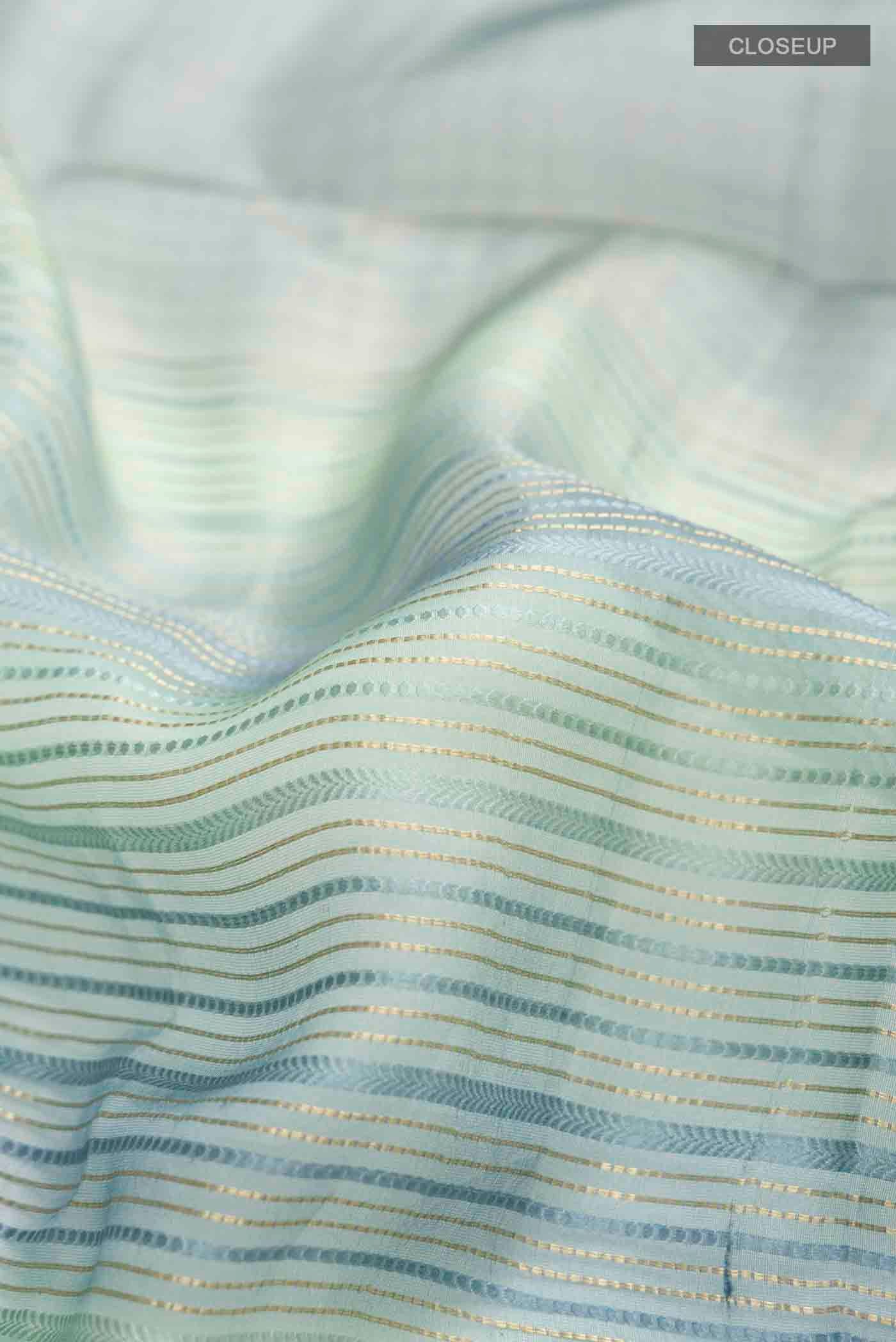Close up of Blue Tussar Silk Saree with Stripes on the body and Zari Border displaying folds