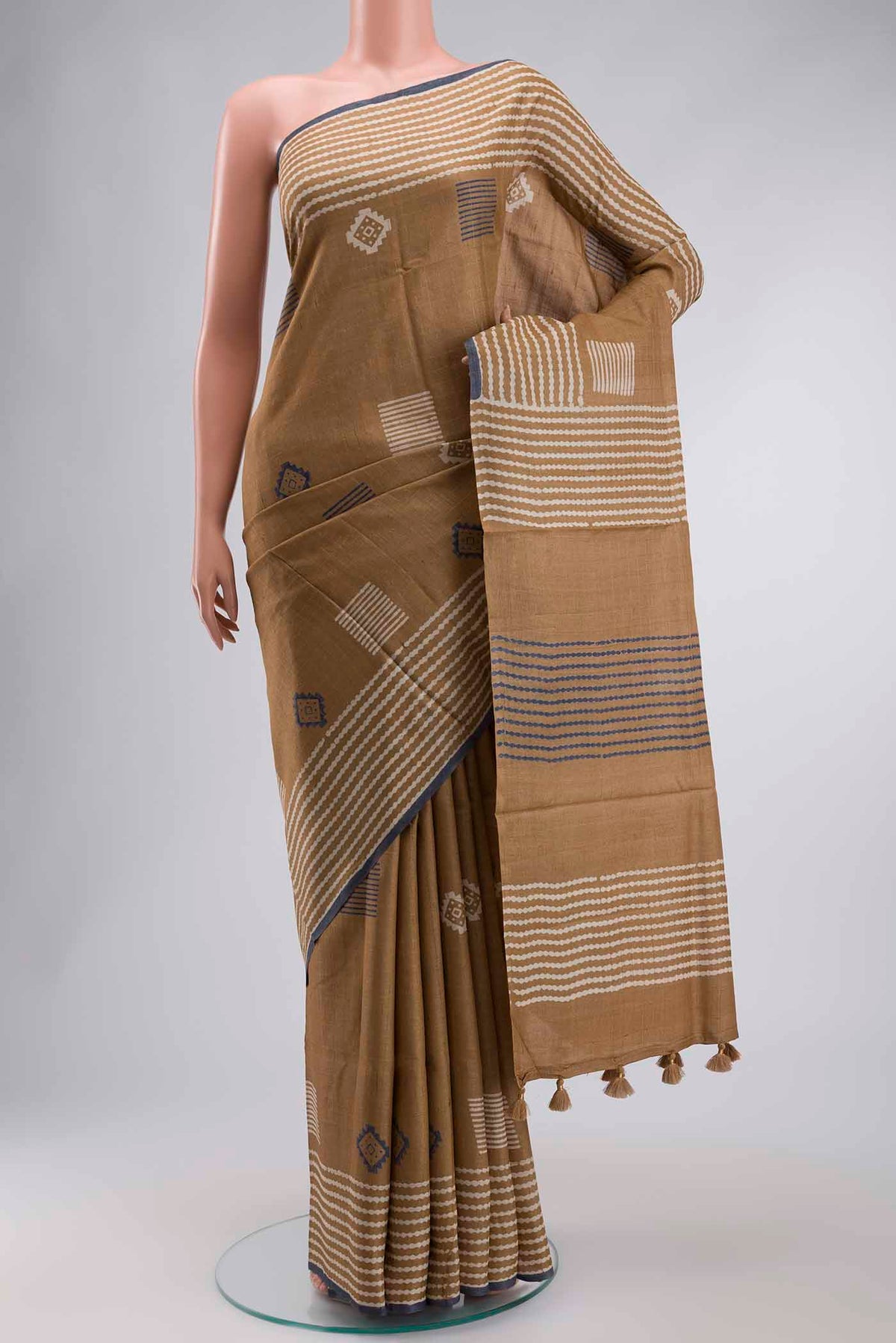 Brown Tussar Silk Saree with Checked design on the body and Plain Border displayed on a mannequin