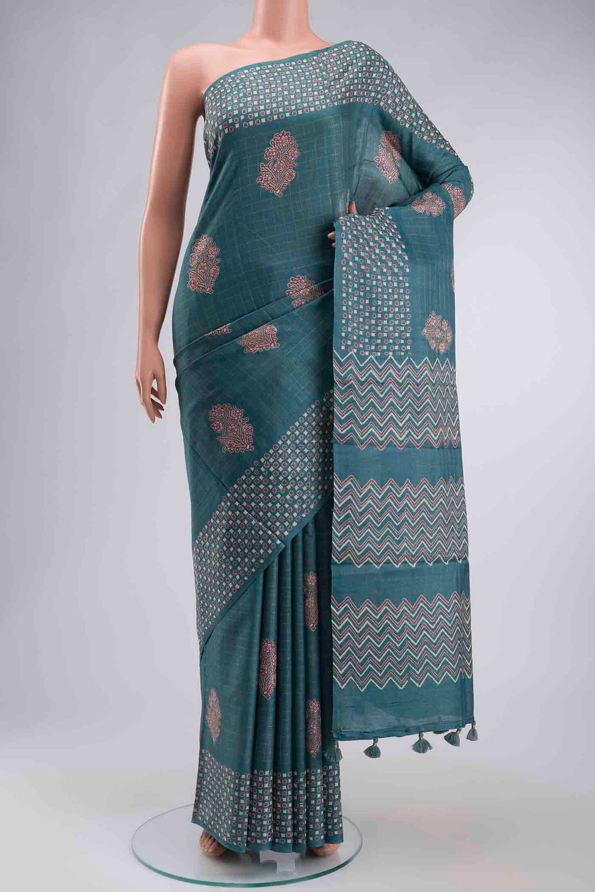 Blue Tussar Silk Saree with Checked design on the body and Printed Border displayed on a mannequin