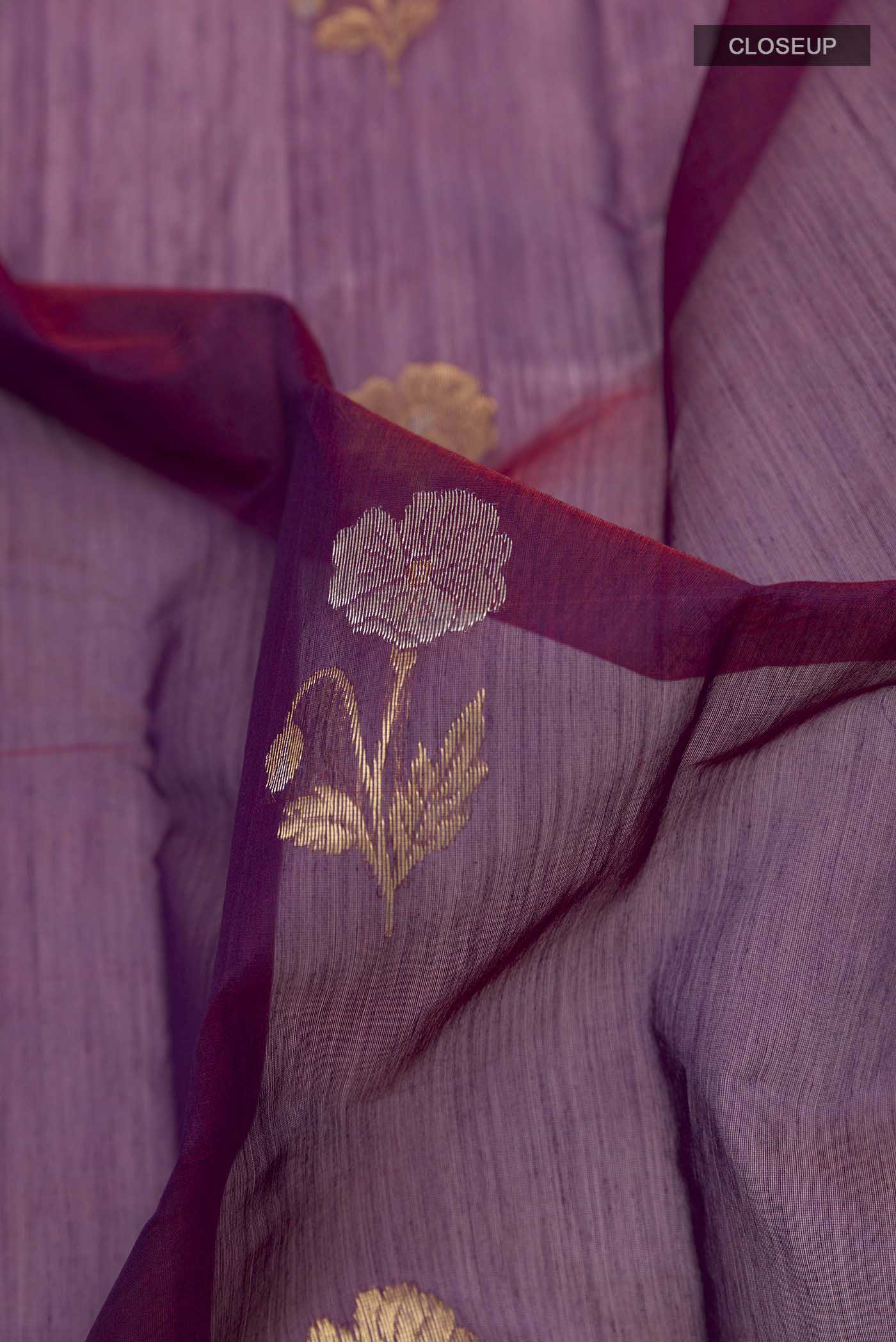 Close up of Purple Chanderi Silk Cotton Saree with Zari Butta on the body and Zari Border displaying folds
