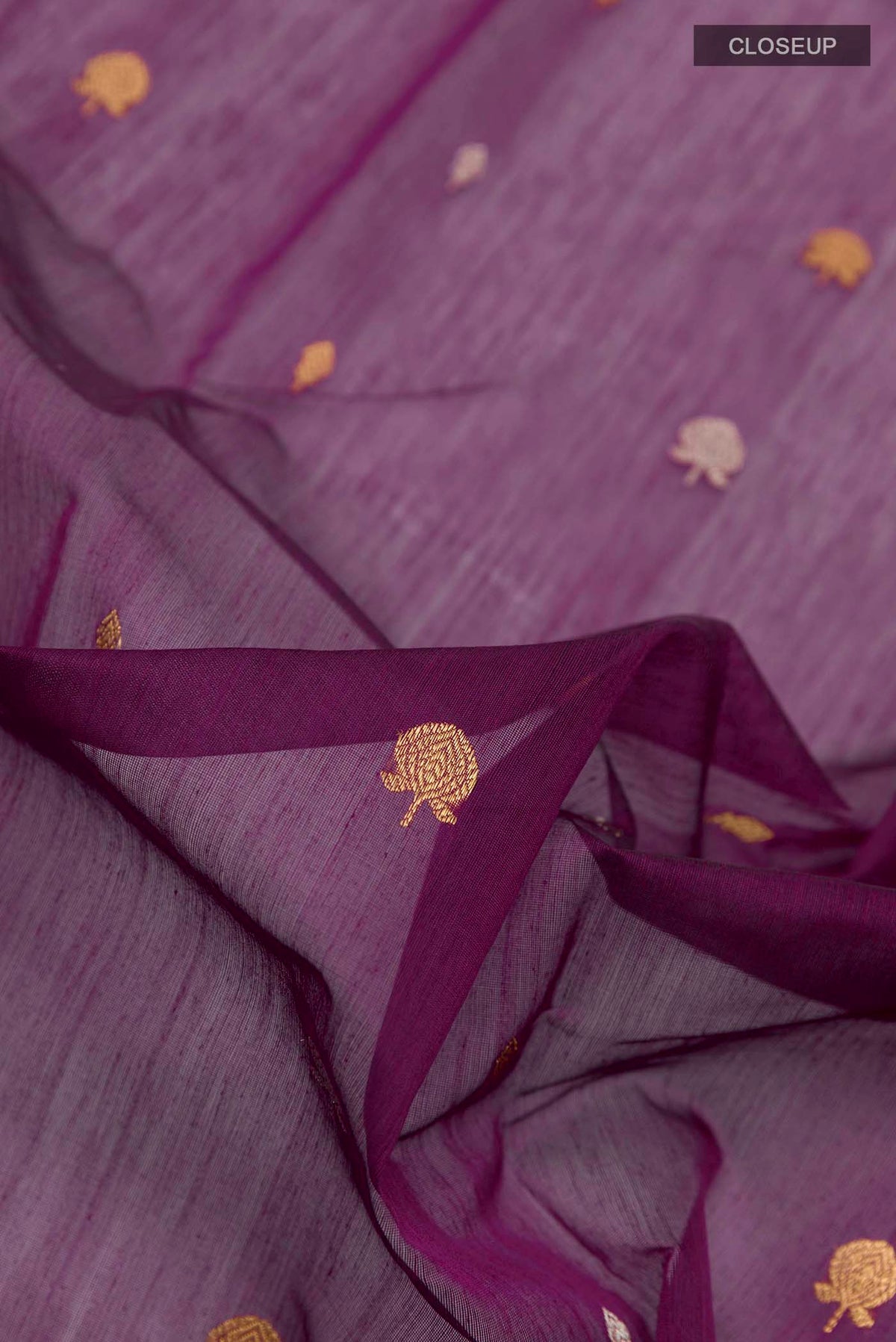 Close up of Purple Chanderi Silk Cotton Saree with Zari Butta on the body and Zari Border displaying folds