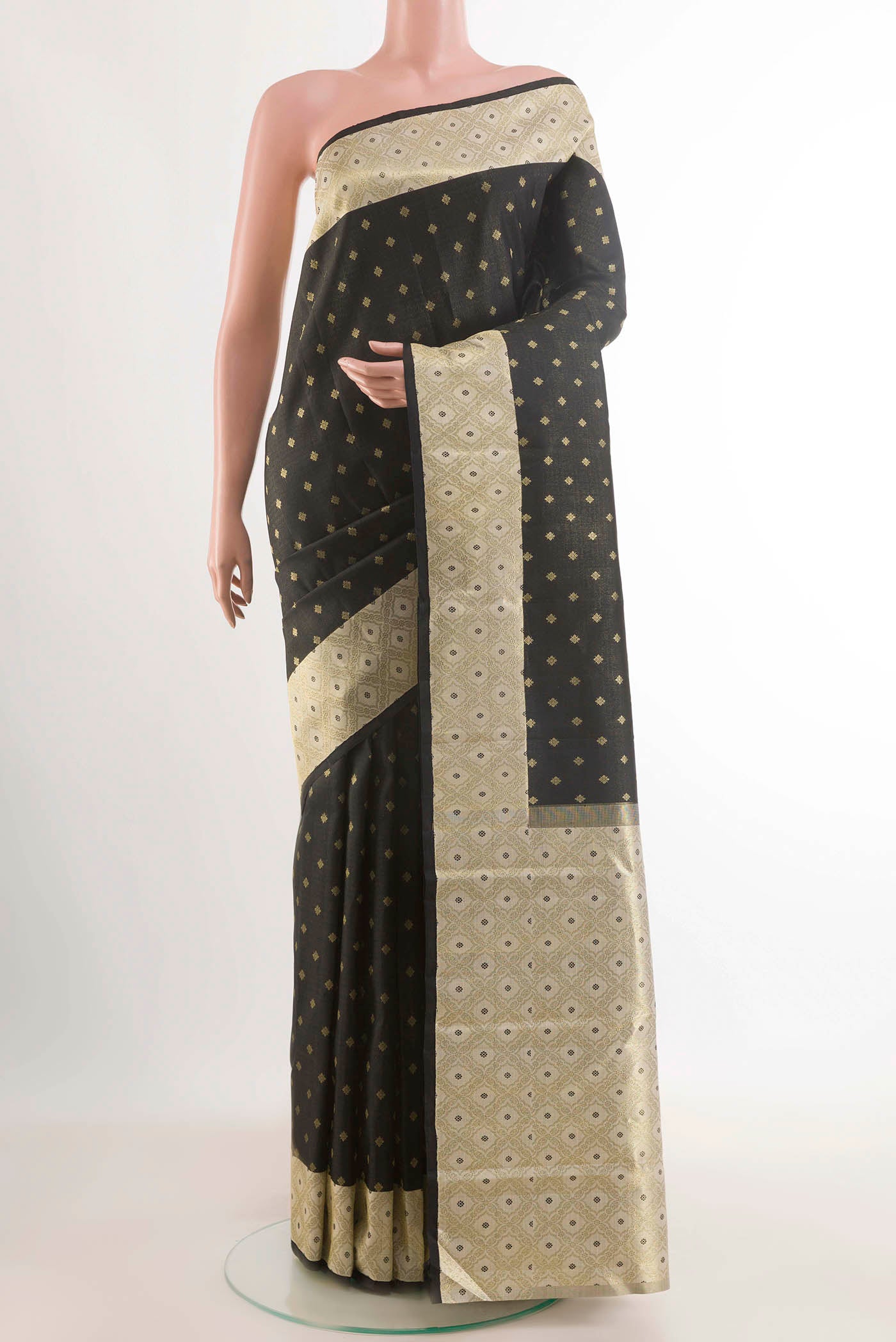 Black Kanchipuram Silk Saree with Zari Butta on the body and Zari Border displayed on a mannequin