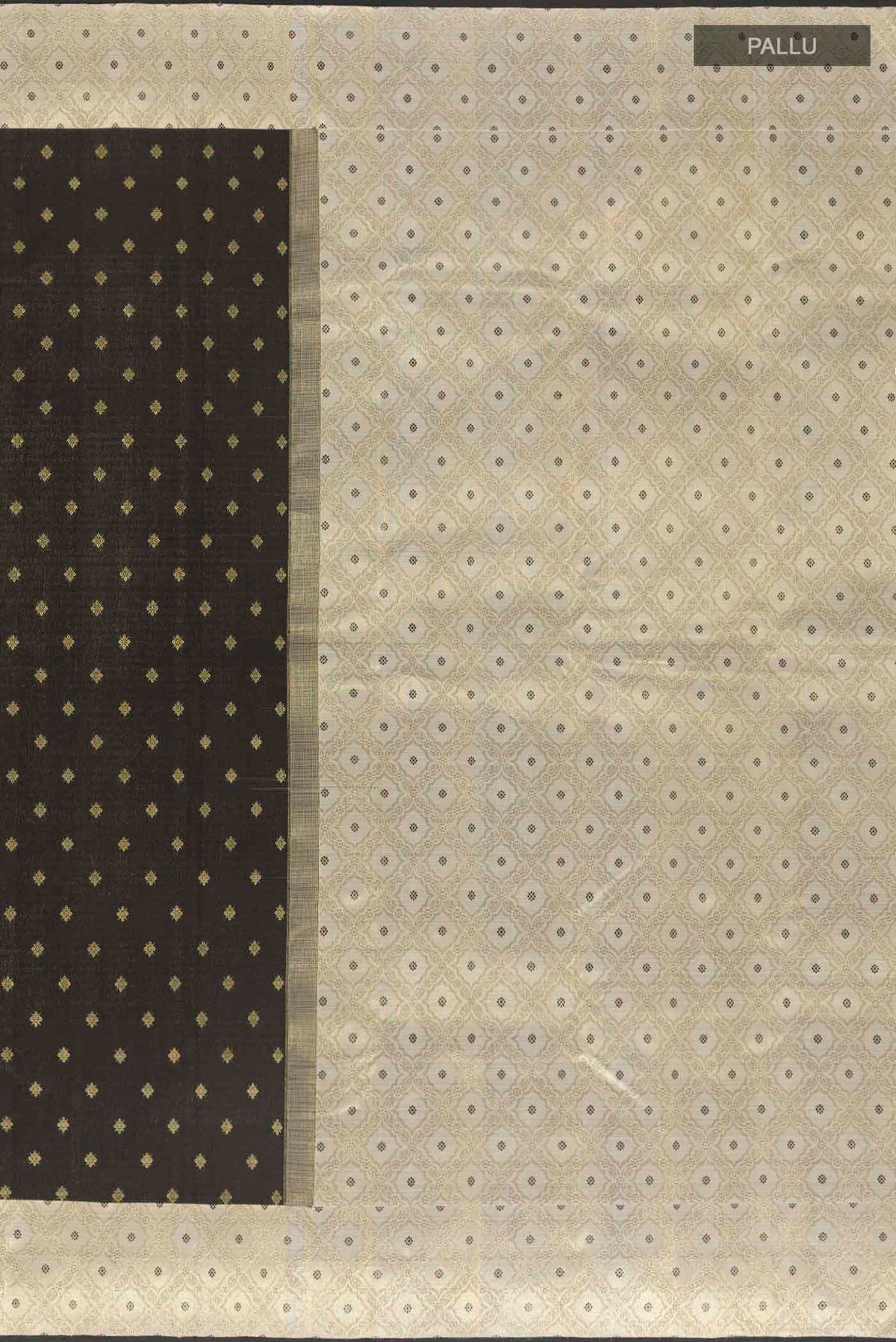 Close up image of the pallu of Black Kanchipuram Silk Saree with Zari Butta on the body and Zari Border