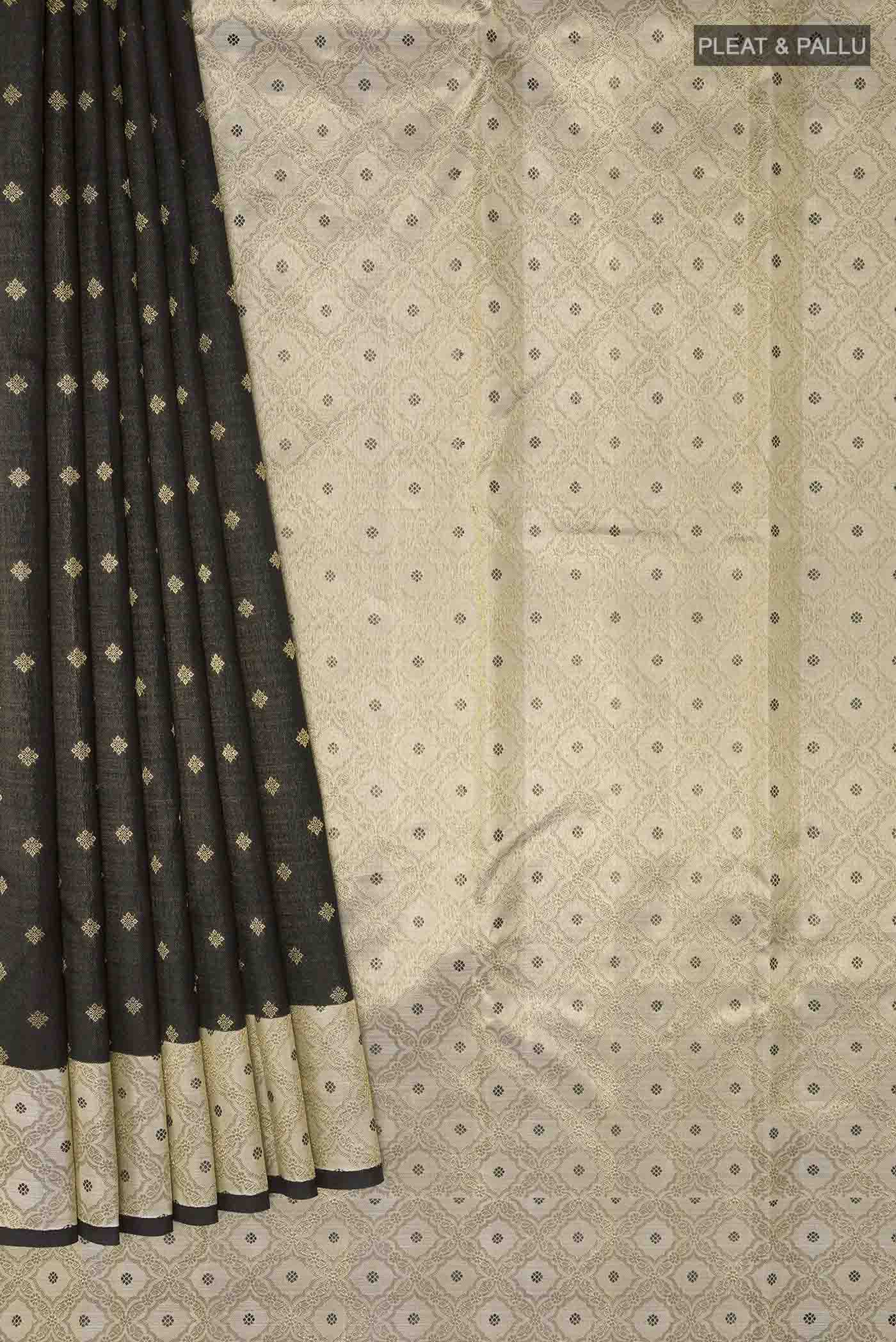 Pleats and pallu of Black Kanchipuram Silk Saree with Zari Butta on the body and Zari Border