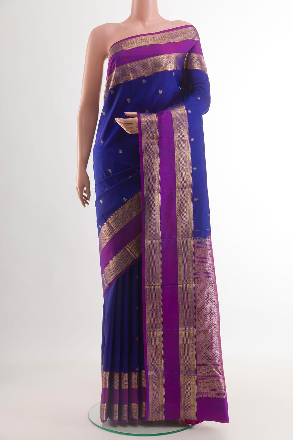 Blue Kanchipuram Silk Saree with Zari Butta on the body and Zari Border.  displayed on a mannequin
