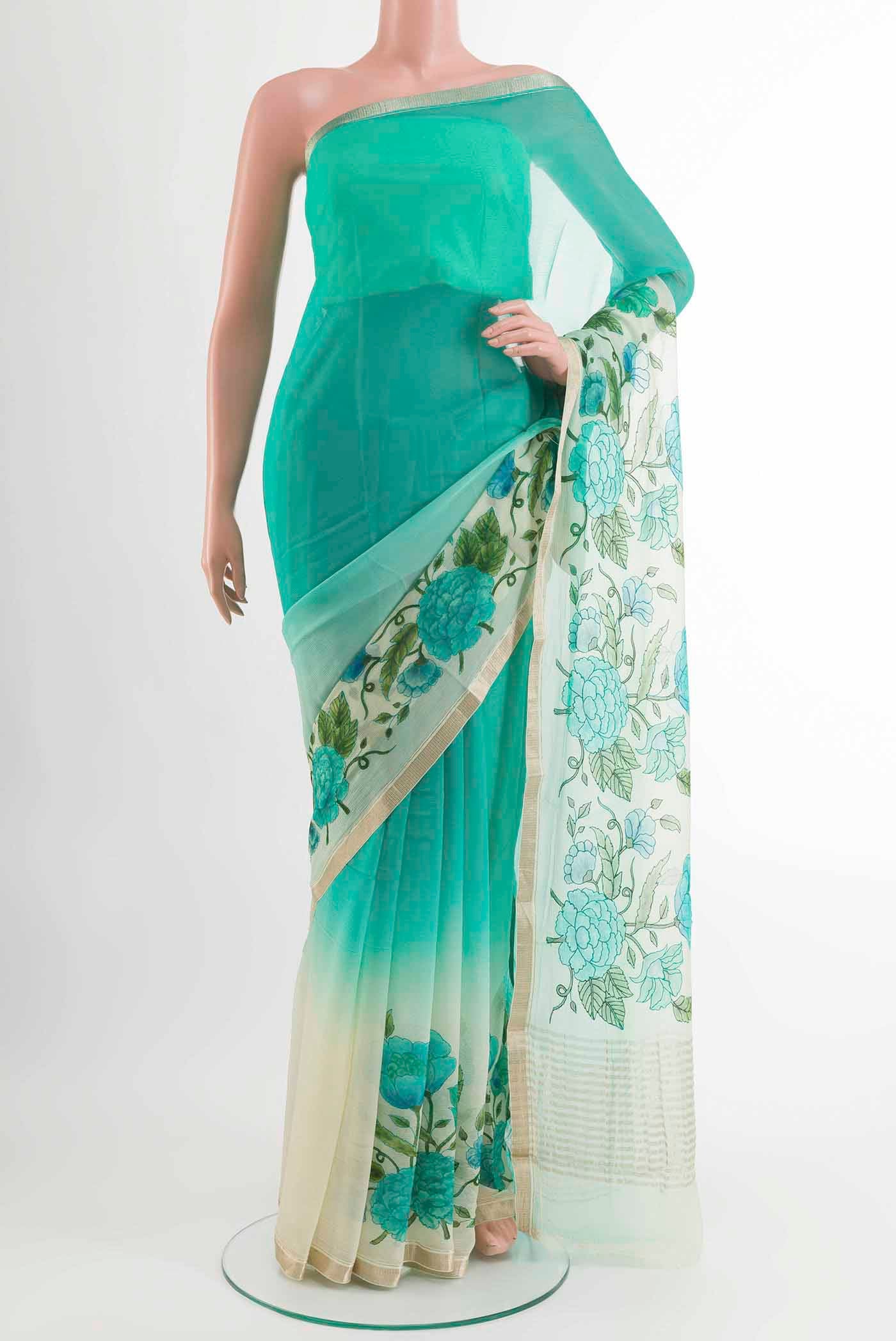 Sea Green Mysore Chiffon Saree with Printed design on the body and Zari Border displayed on a mannequin