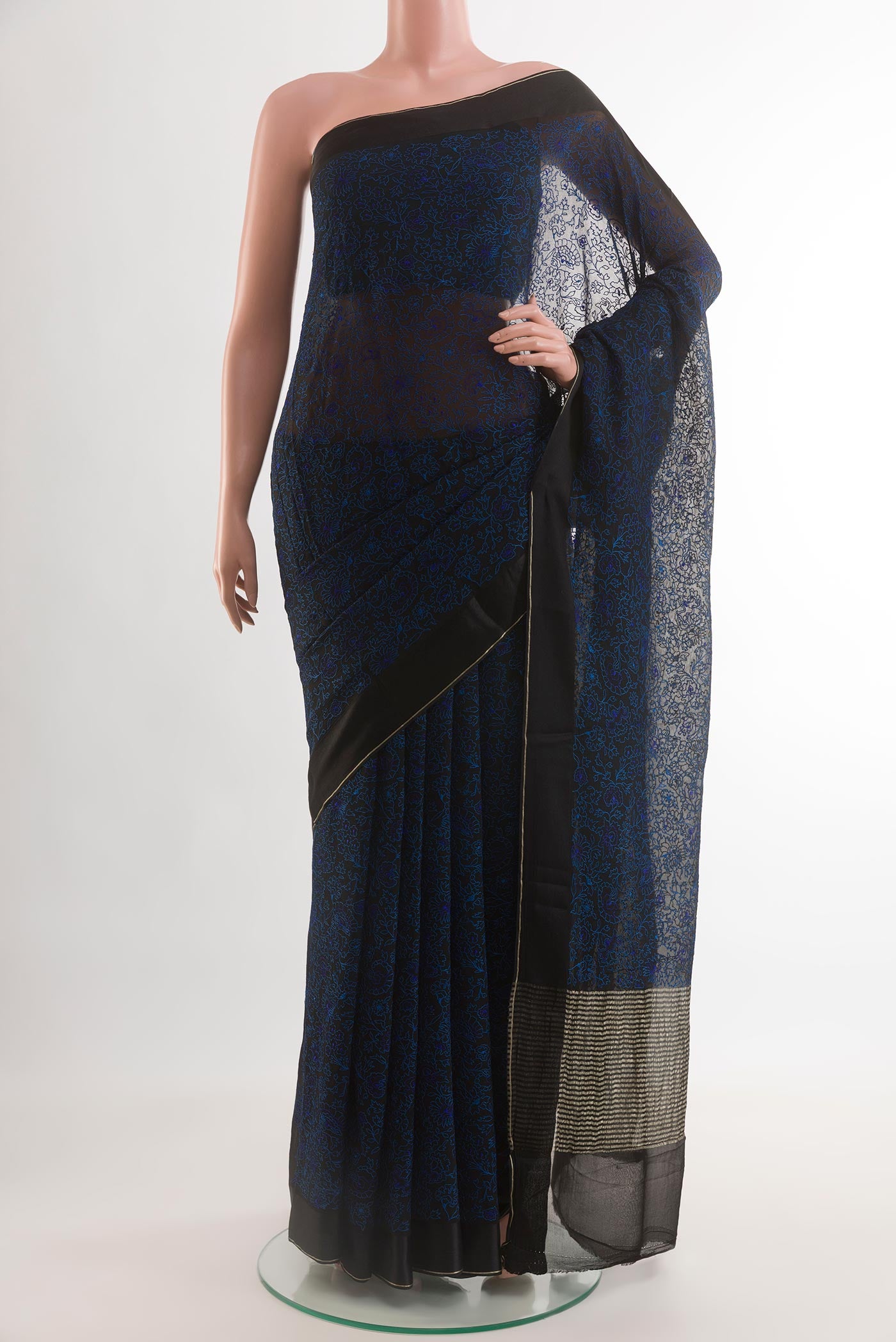 Navy Blue Mysore Chiffon Saree with Embroidery on the body and Thread Border.  displayed on a mannequin