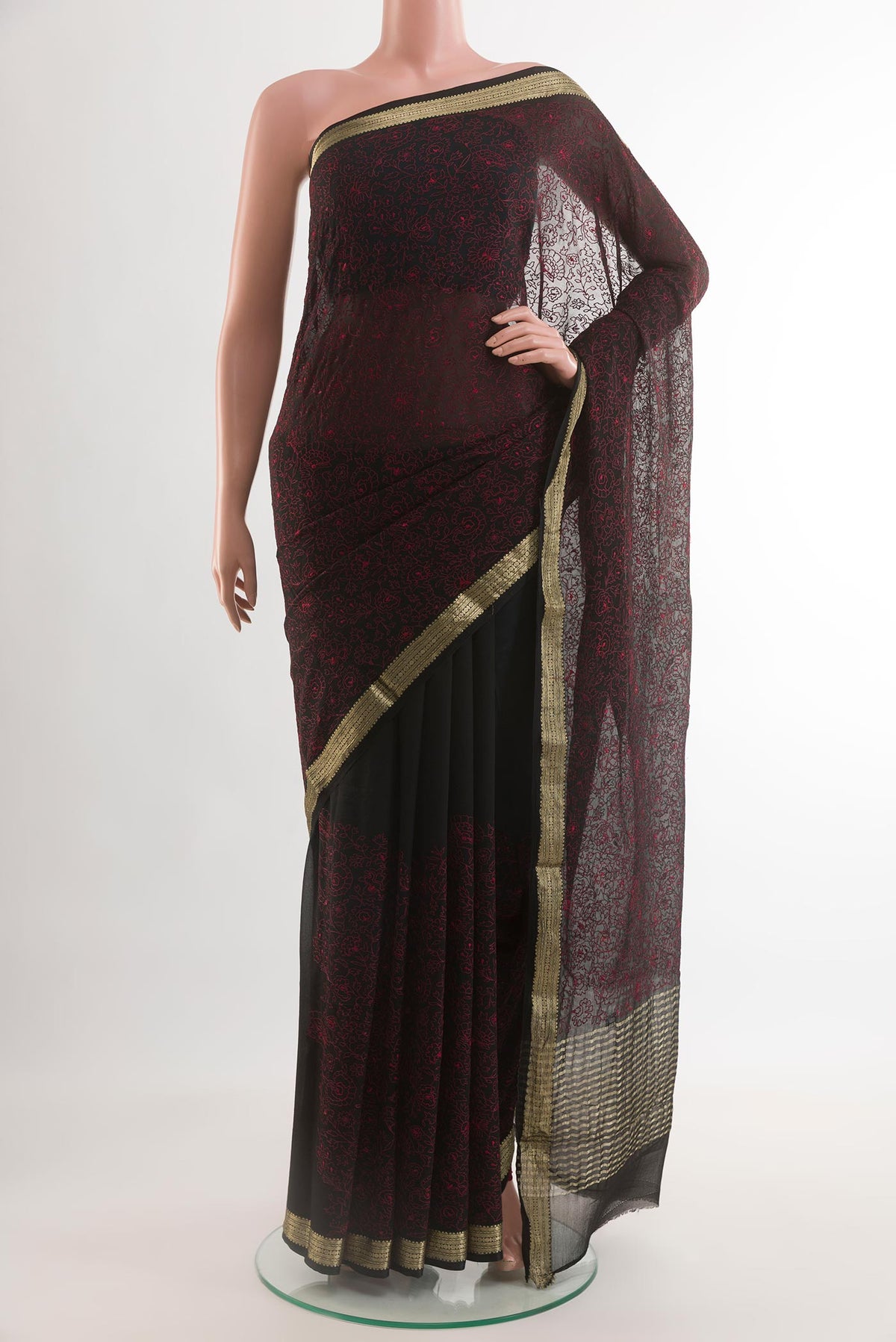 Black Mysore Chiffon Saree with Embroidery on the body and Zari Border.  displayed on a mannequin