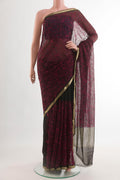 Black Mysore Chiffon Saree with Embroidery on the body and Zari Border.  displayed on a mannequin