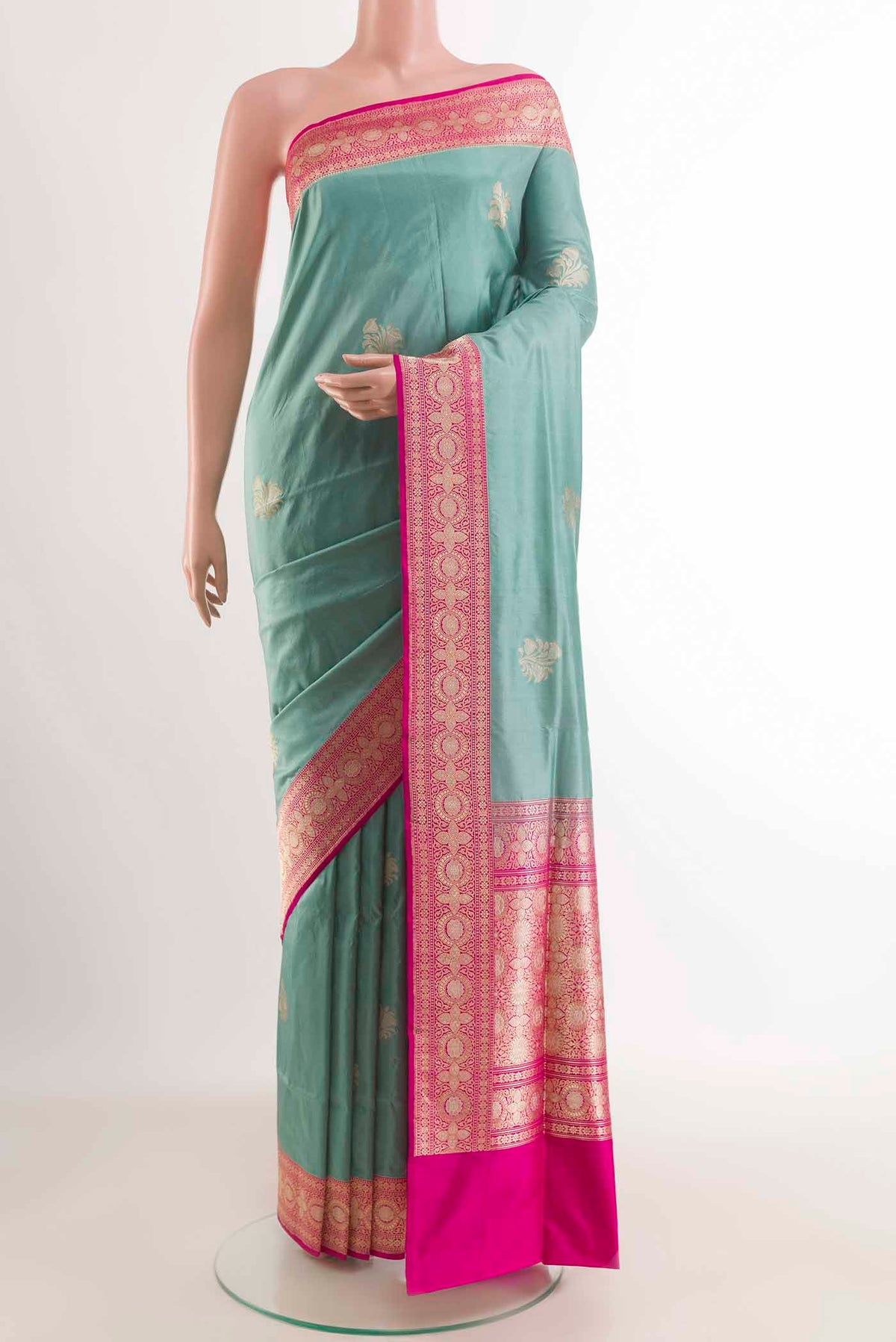 Blue Grey Banarasi Silk Saree with Zari Butta on the body and Zari Border displayed on a mannequin