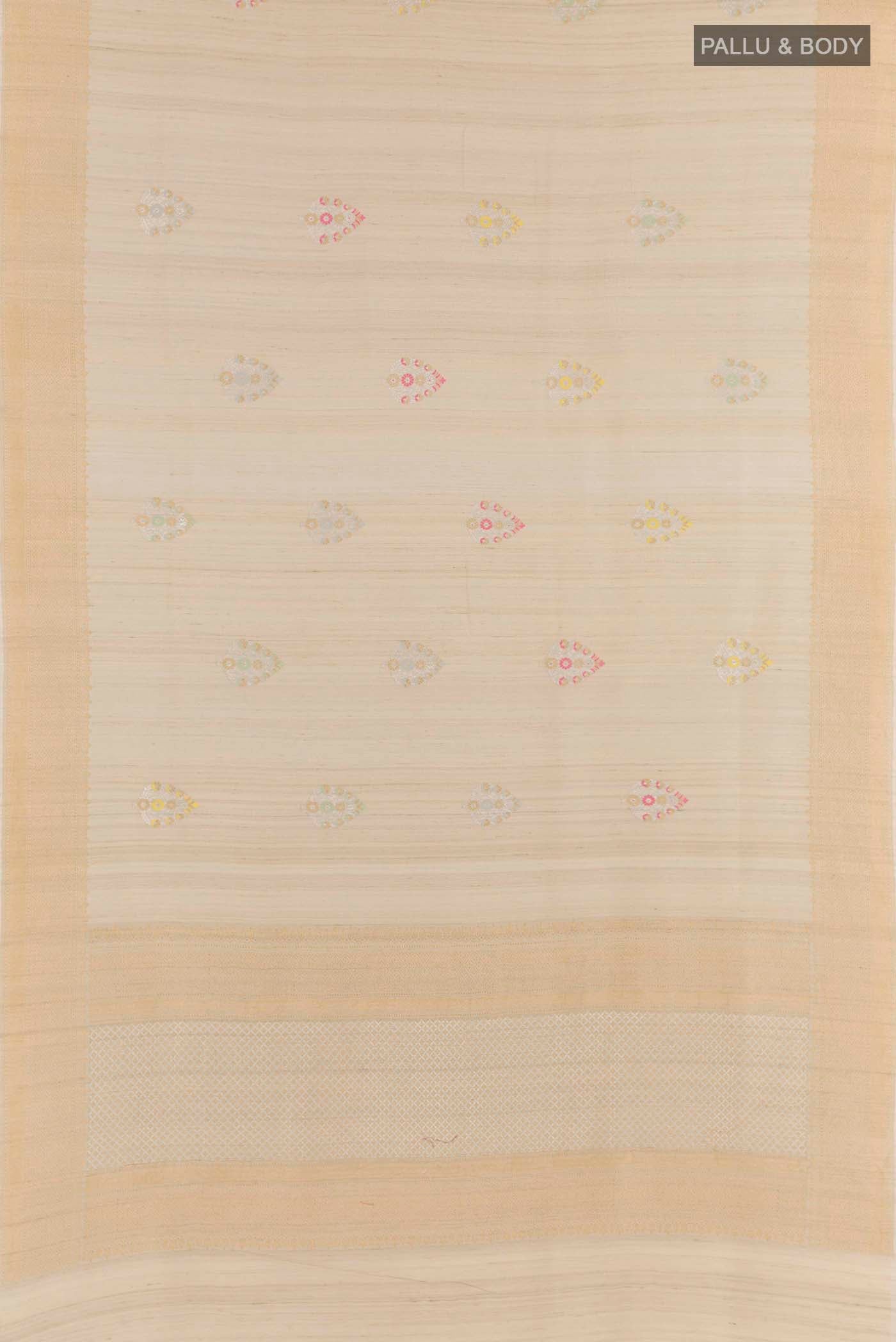 Flat view of Cream Tussar Saree with Zari Butta on the body and Zari Border