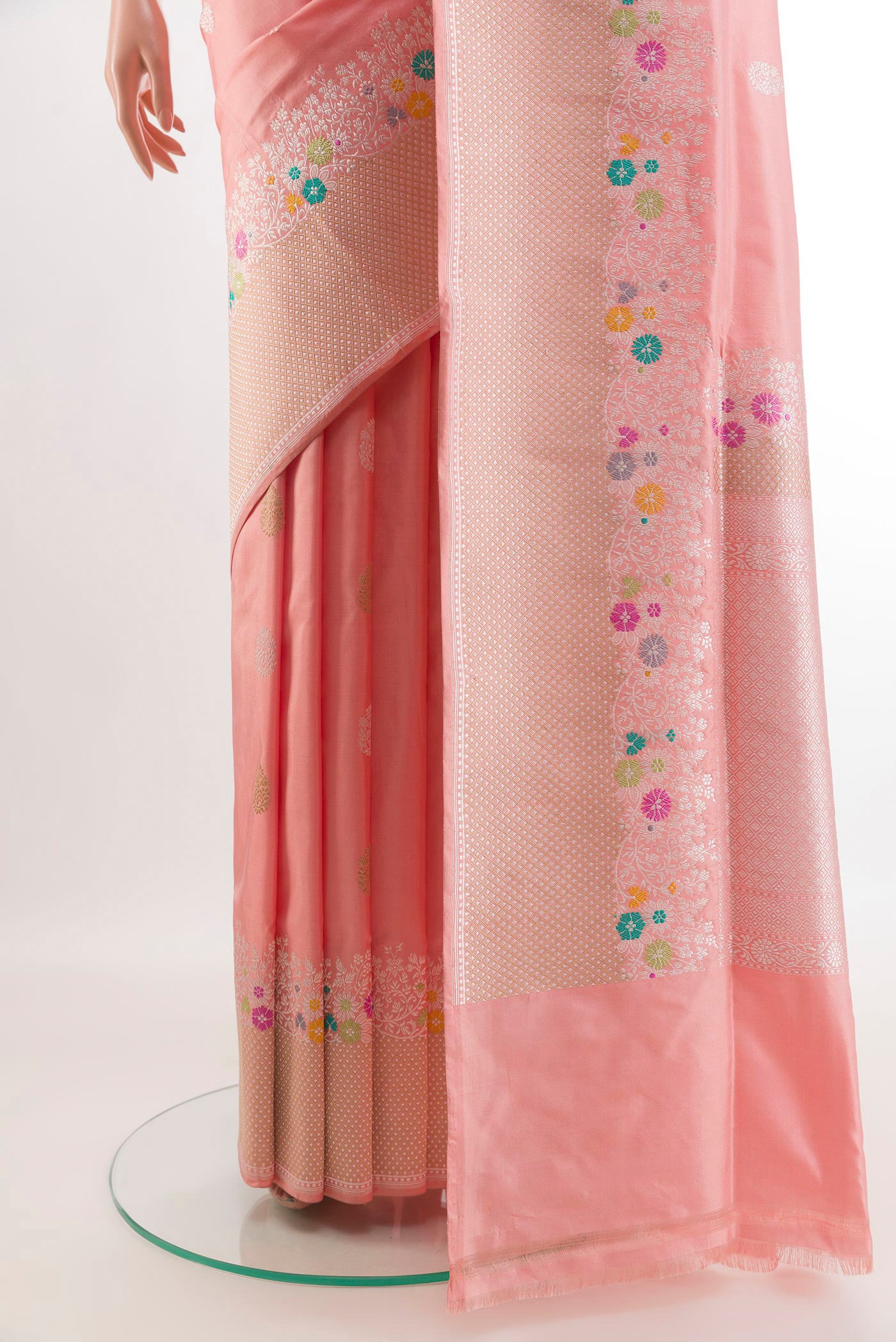 Pleats and pallu of Rose pink Banarasi Silk Saree with Zari Butta on the body and Zari Border. 