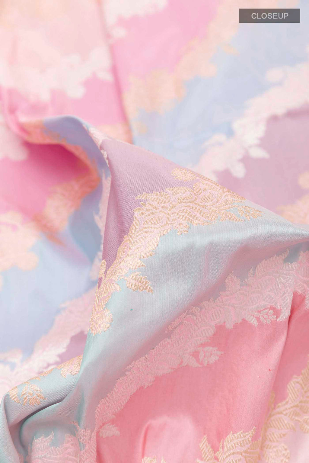 Close up of Multi Color Banarasi Silk Saree with Zari Brocade on the body and Zari Border displaying folds