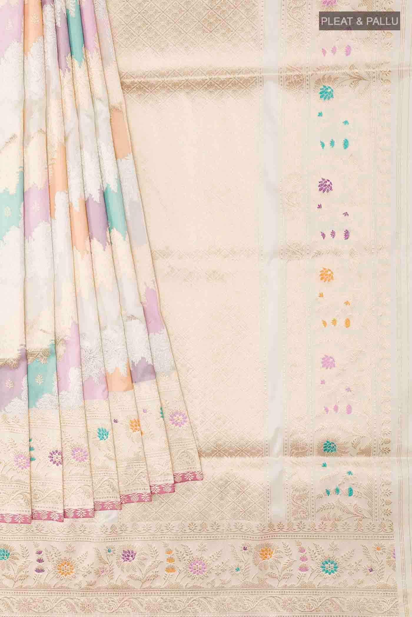 Pleats and pallu of Off White Banarasi Silk Saree with Zari Brocade on the body and Zari Border