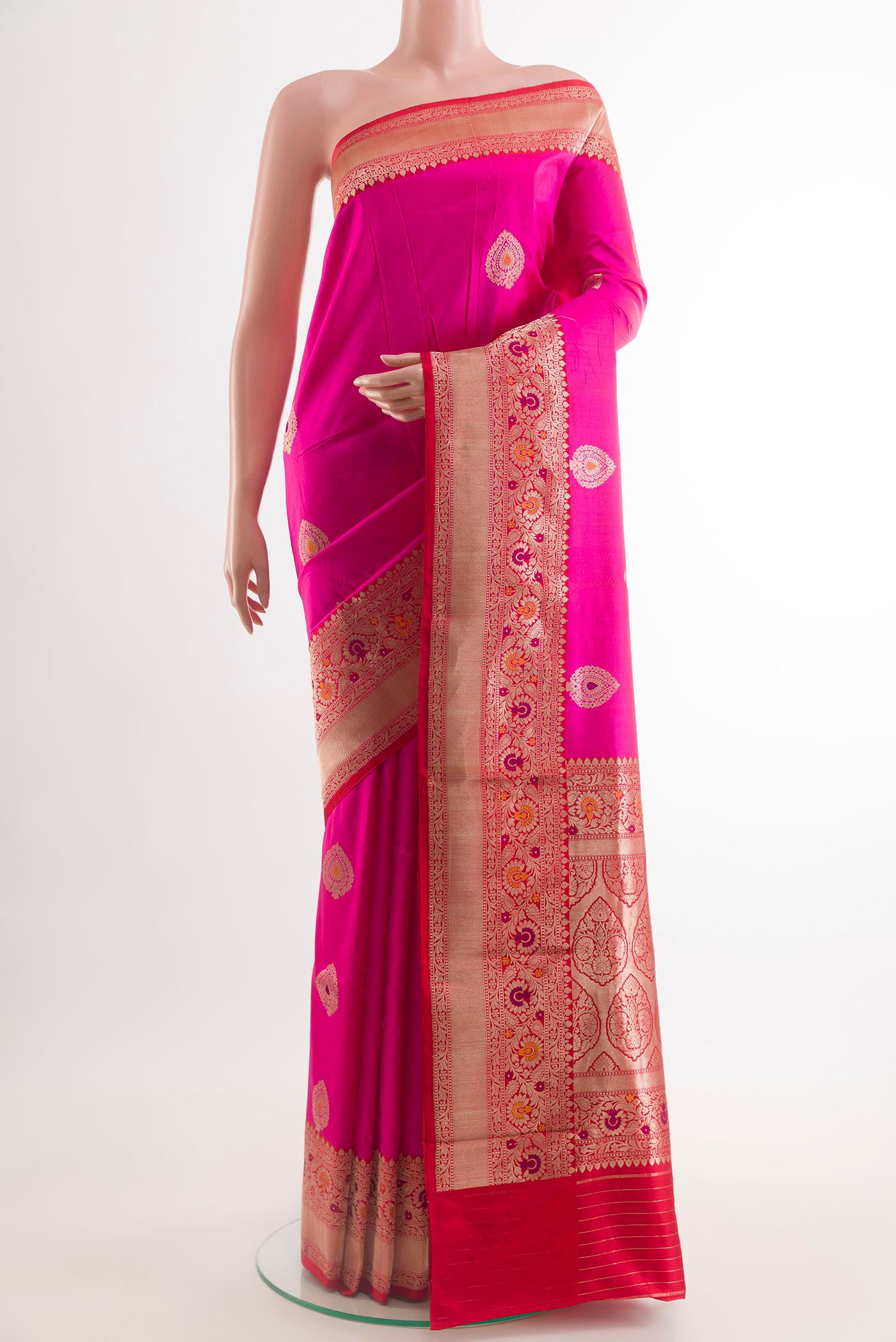 Pink Banarasi Katan Silk Saree with Zari Butta on the body and Zari Border.  displayed on a mannequin