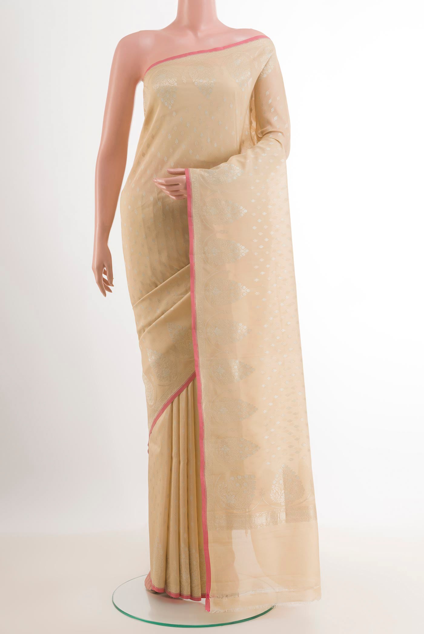 Beige Banarasi Katan Silk Saree with Zari Butta on the body and Zari Border.  displayed on a mannequin