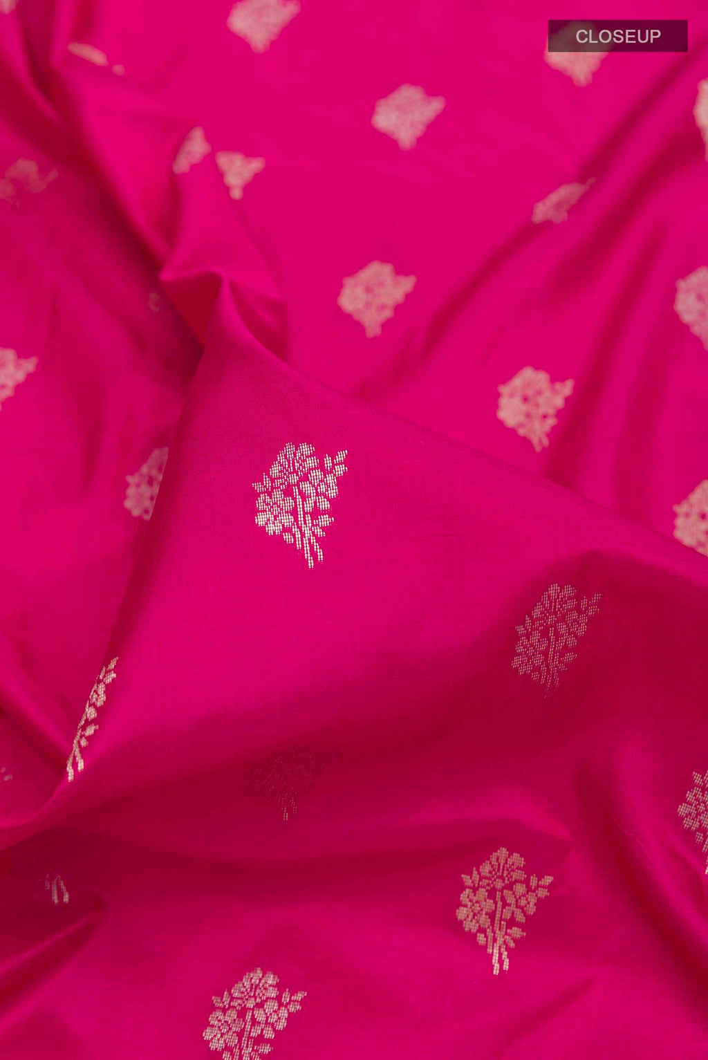 Close up of Pink Banarasi Silk Saree with Zari Butta on the body and Zari Border displaying folds