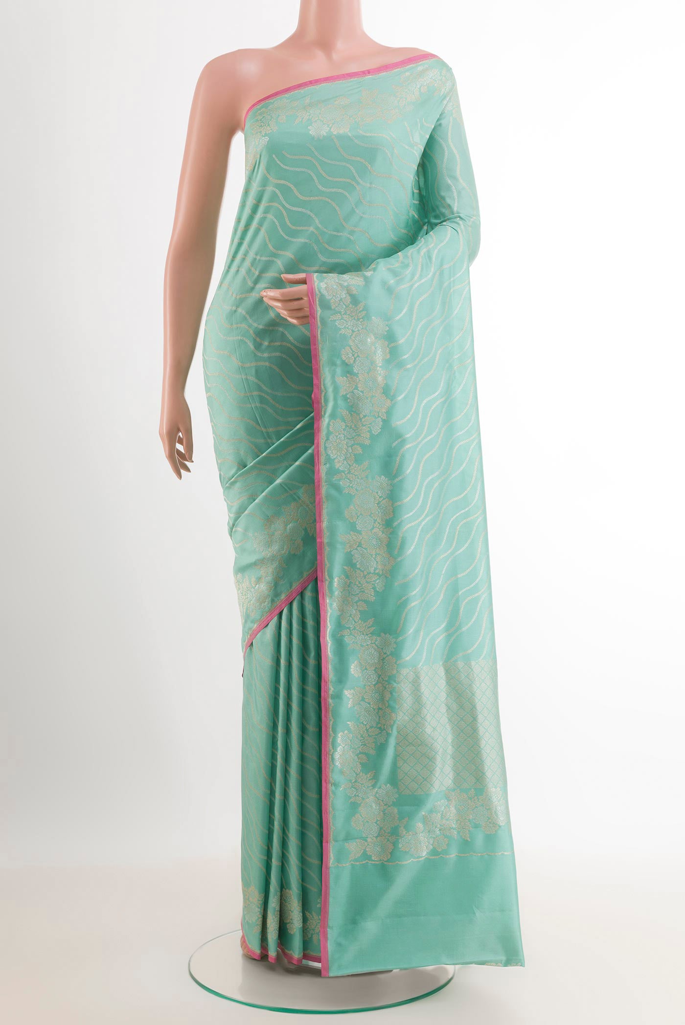 Blue Banarasi Katan Silk Saree with Stripes on the body and Zari Border.  displayed on a mannequin