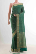 Green Mysore Crepe Saree with Zari Brocade on the body and Zari Border displayed on a mannequin