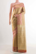 Golden Kanchipuram Tissue Silk Saree with Zari Brocade on the body and Zari Border displayed on a mannequin
