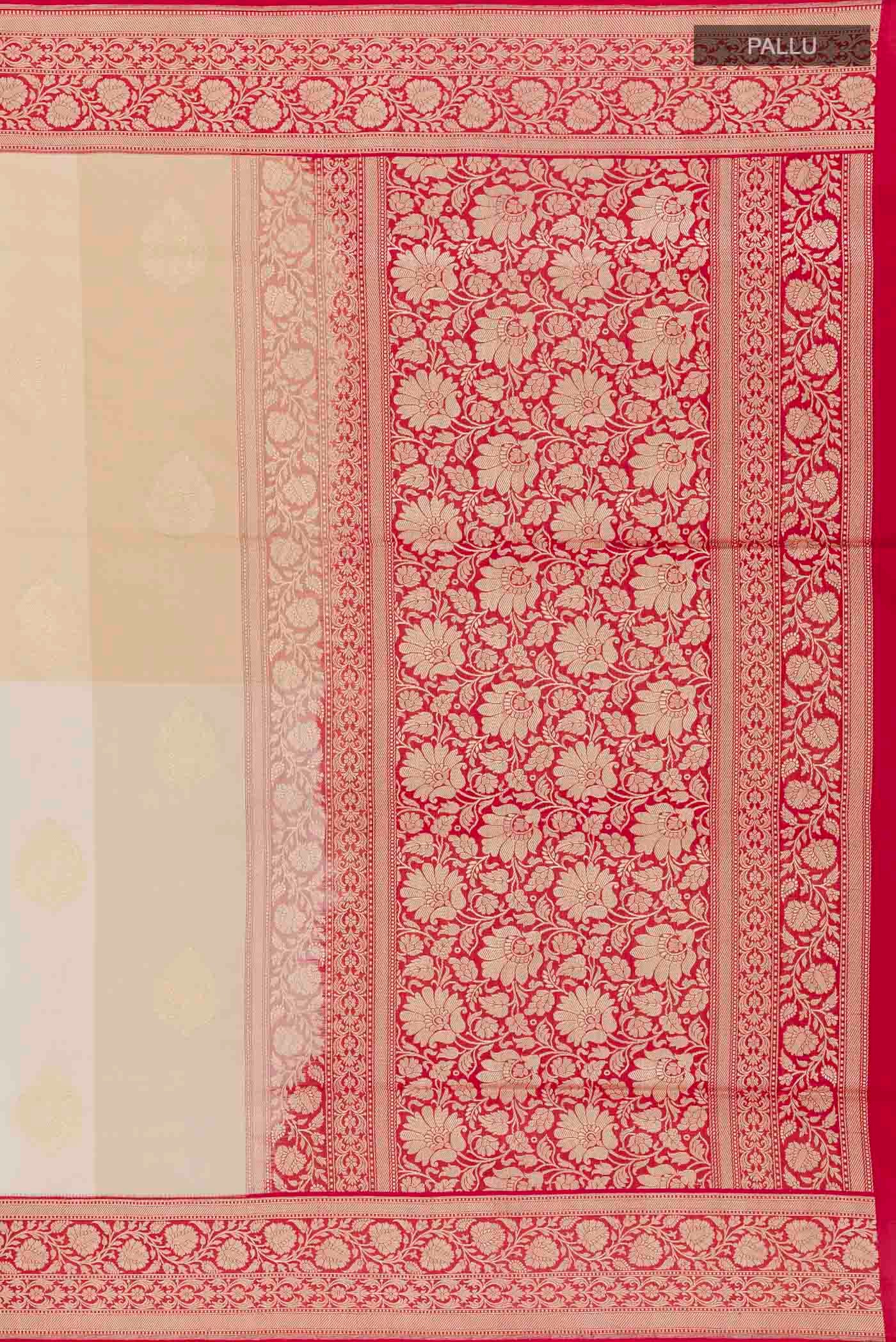 Close up image of the pallu of Off White Banarasi Silk Saree with Zari Butta on the body and Zari Border