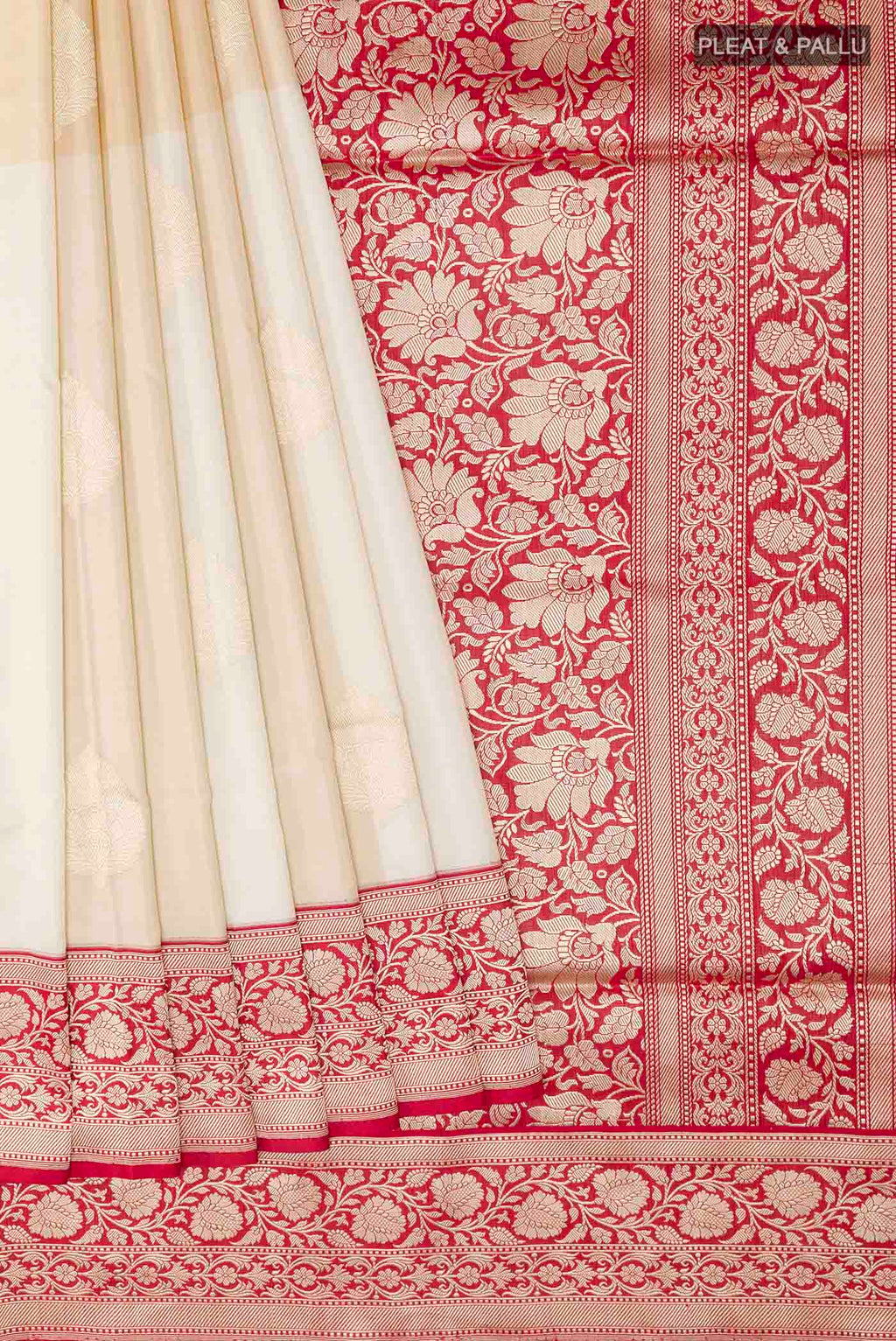 Pleats and pallu of Off White Banarasi Silk Saree with Zari Butta on the body and Zari Border
