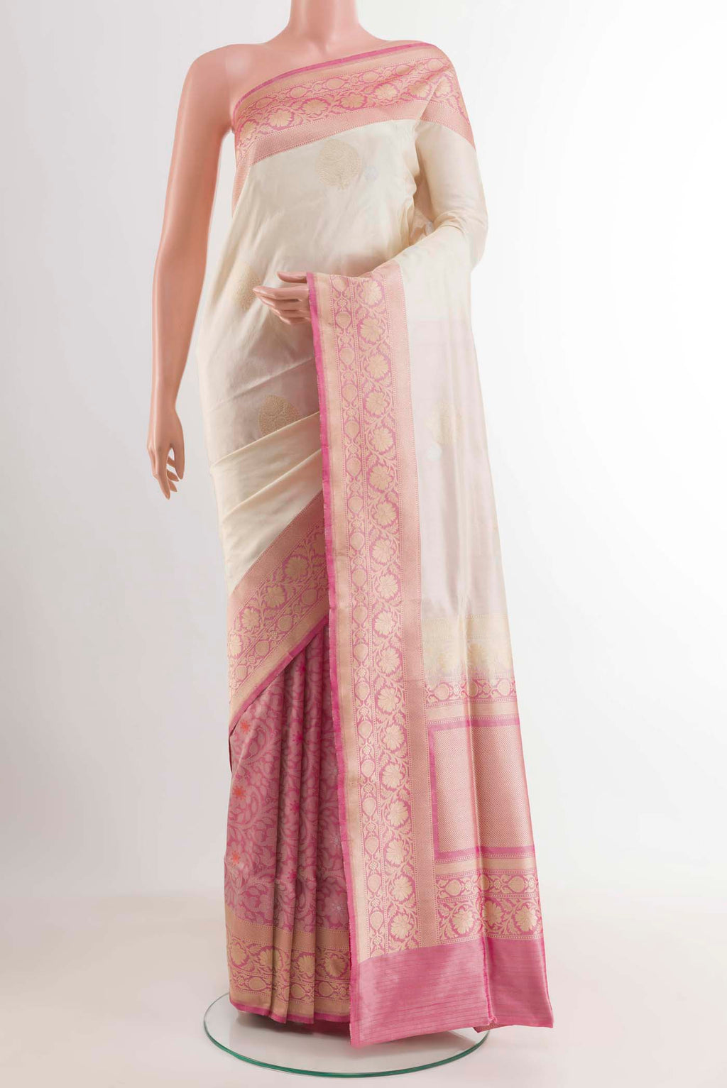 Off White Banarasi Silk Saree with Half And Half on the body and Zari Border displayed on a mannequin